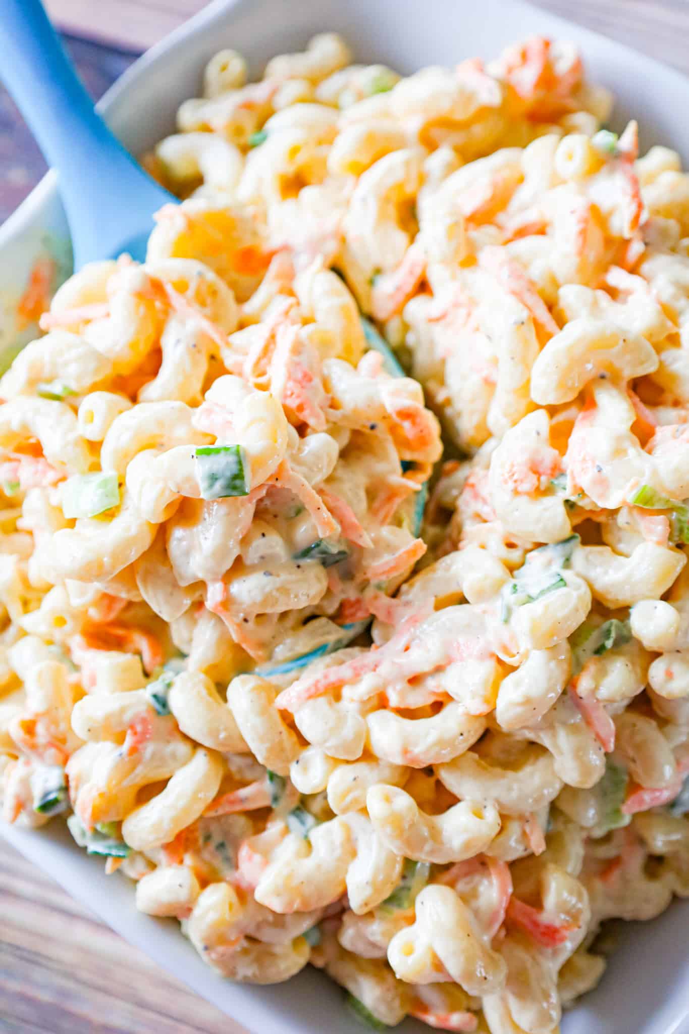 Hawaiian Macaroni Salad is a creamy pasta salad recipe loaded with grated carrots, yellow onion and chopped green onion.