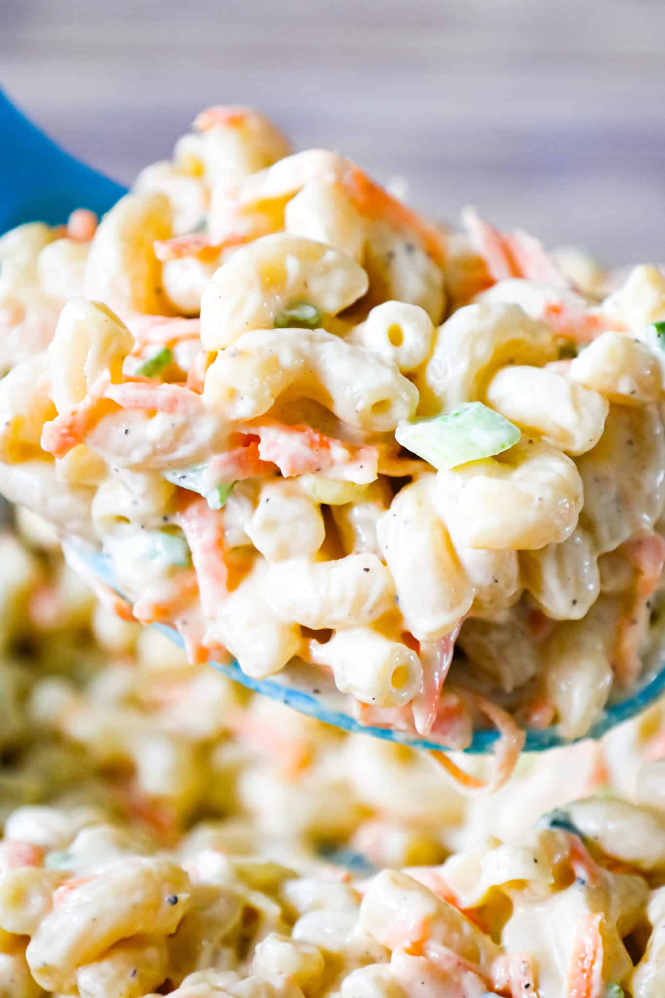 Hawaiian Macaroni Salad is a creamy pasta salad recipe loaded with grated carrots, yellow onion and chopped green onion.