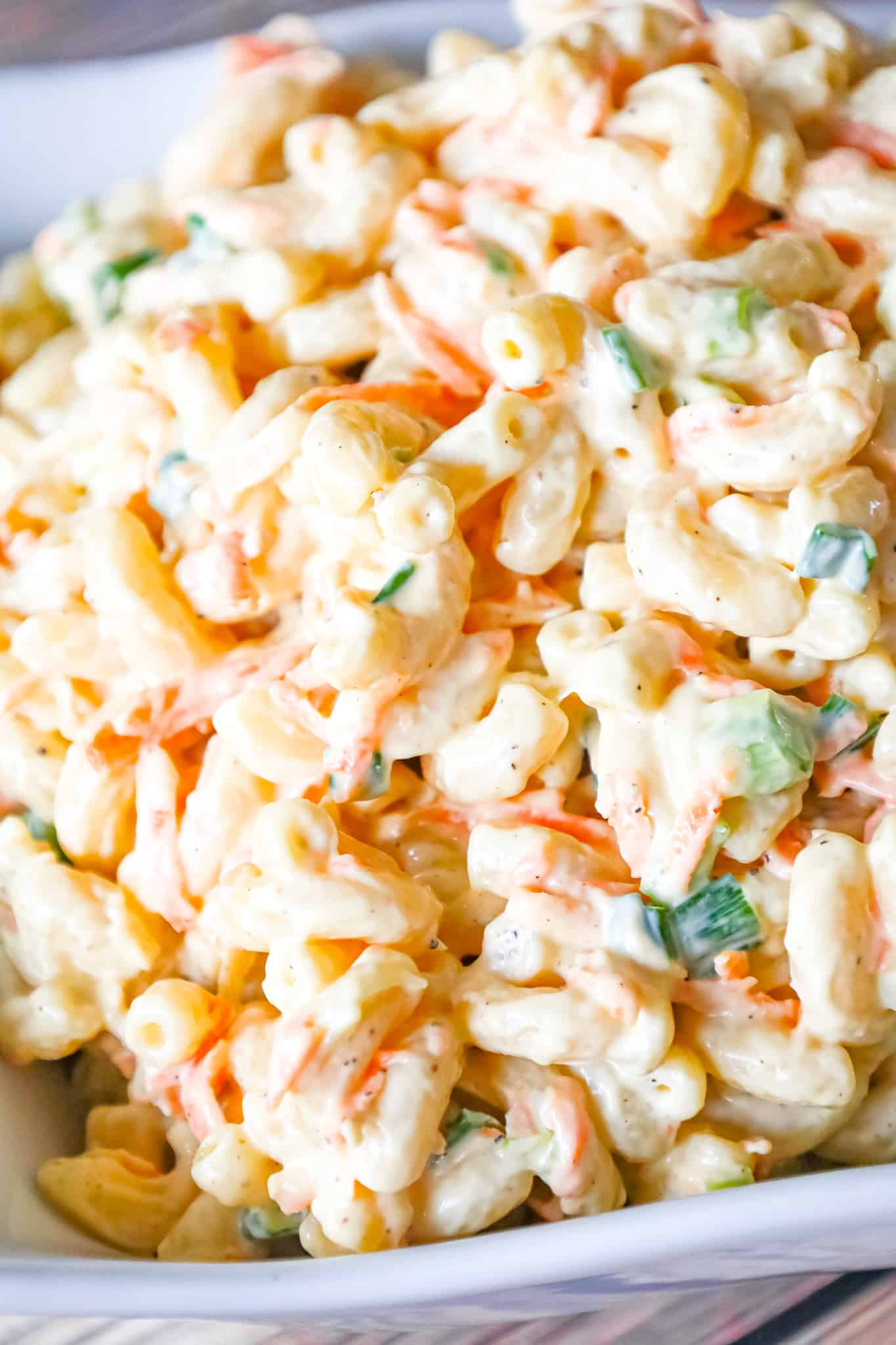 Hawaiian Macaroni Salad is a creamy pasta salad recipe loaded with grated carrots, yellow onion and chopped green onion.