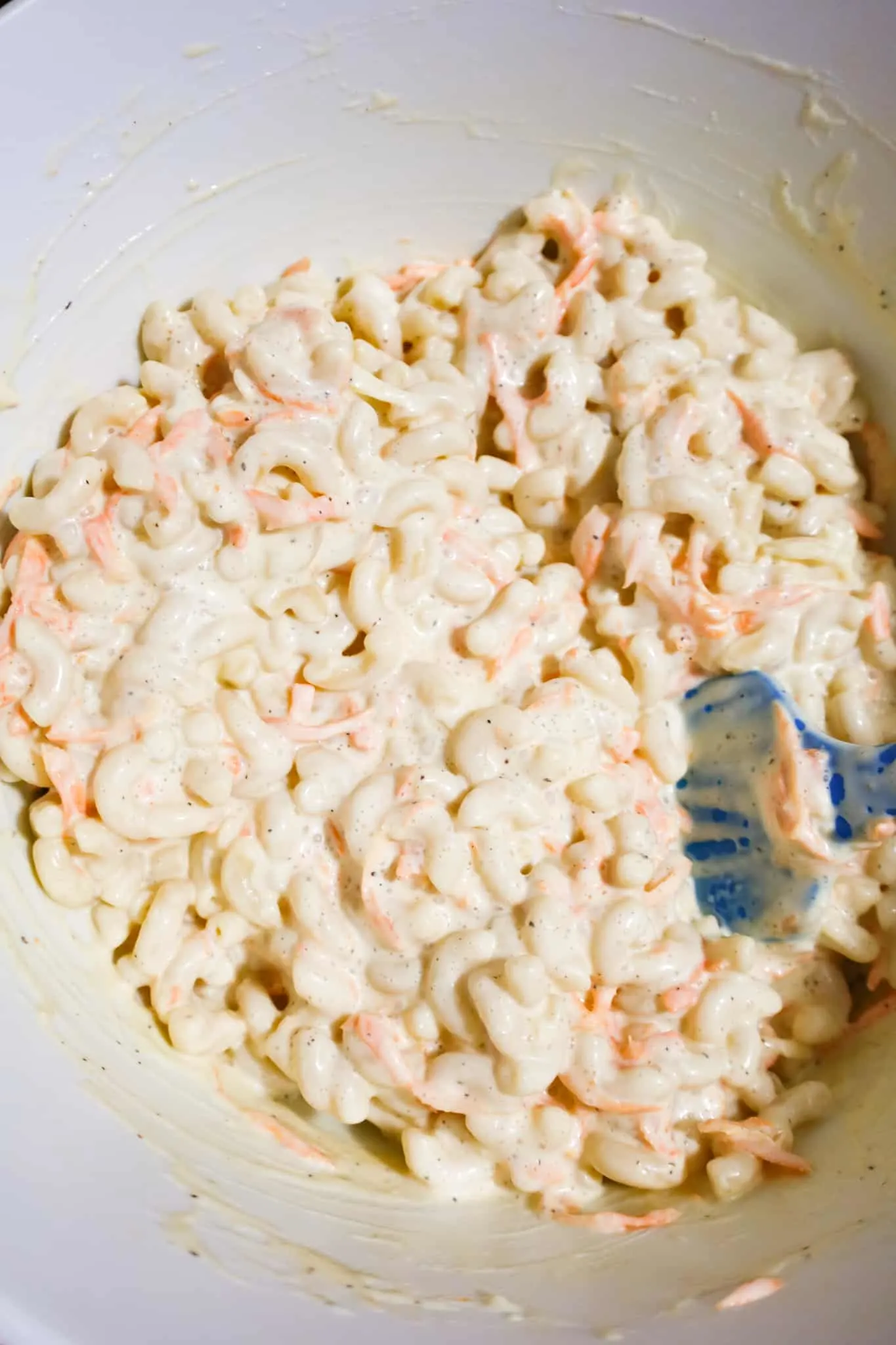 macaroni salad and creamy mayo dressing stirred together