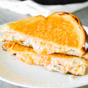 Jalapeno Popper Grilled Cheese is an easy lunch or dinner recipe loaded with shredded cheddar cheese, cream cheese, sour cream and jalapeno slices.