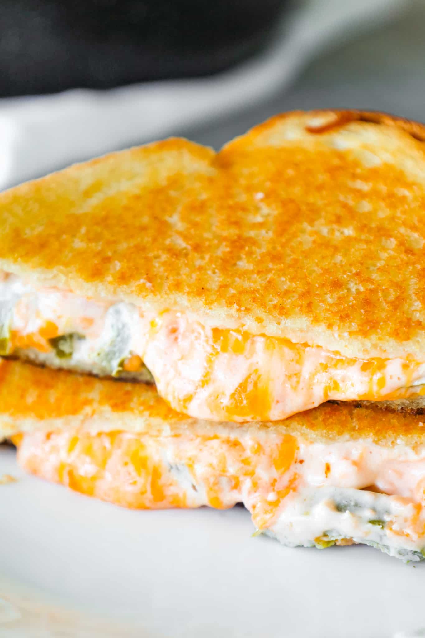 Jalapeno Popper Grilled Cheese is an easy lunch or dinner recipe loaded with shredded cheddar cheese, cream cheese, sour cream and jalapeno slices.