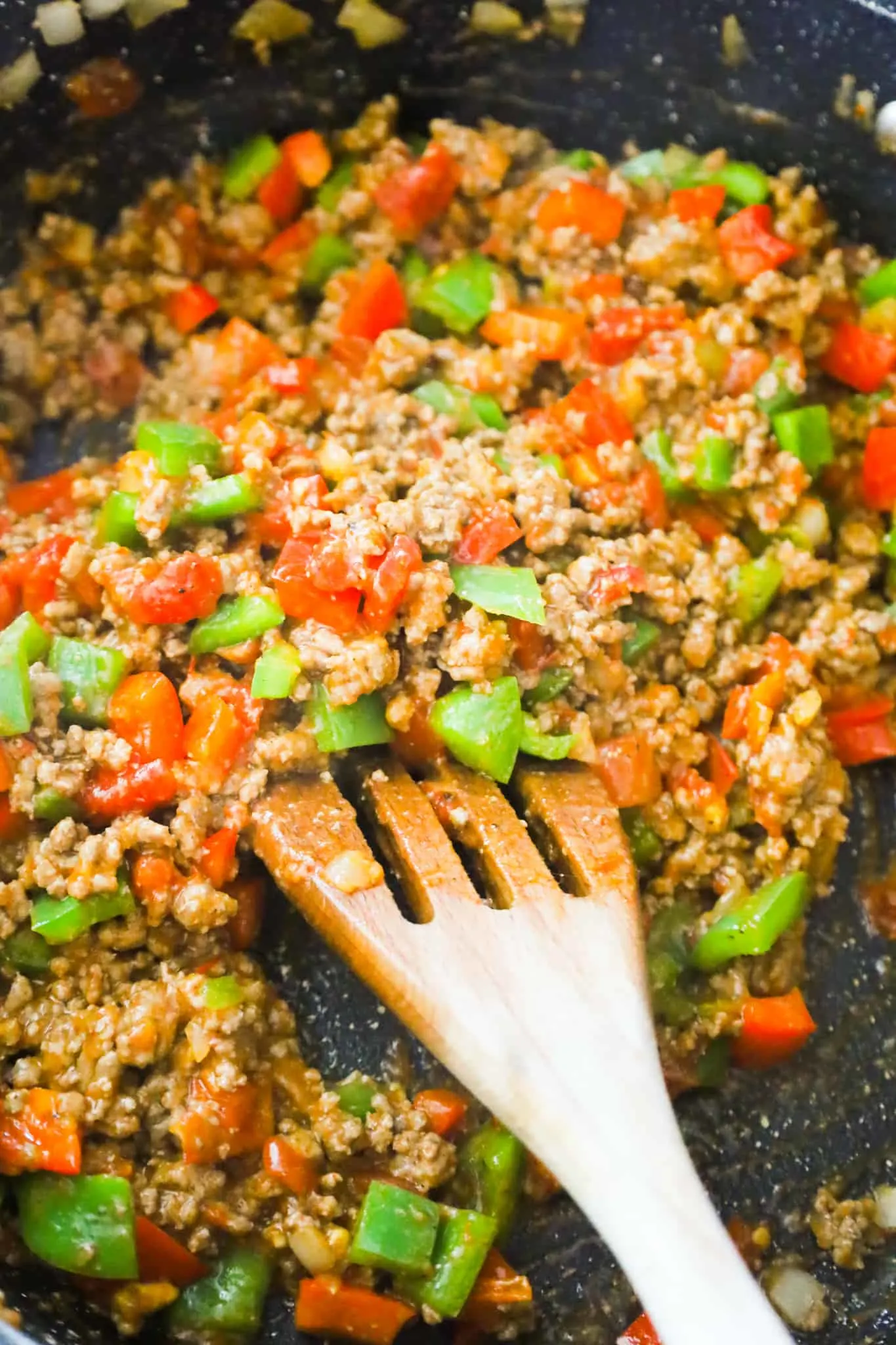 ground beef and diced peppers mixed with Rotel