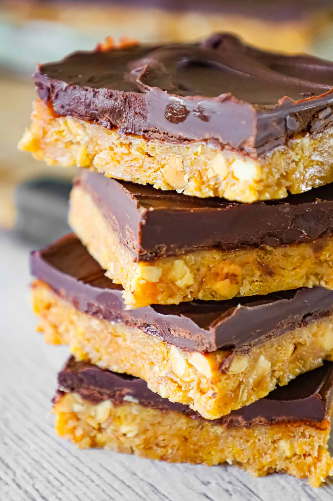 Peanut Butter Cornflake Bars are a decadent chocolate peanut butter dessert recipe made with corn syrup, crunchy peanut butter, crumbled cornflakes cereal and semi sweet chocolate chips.