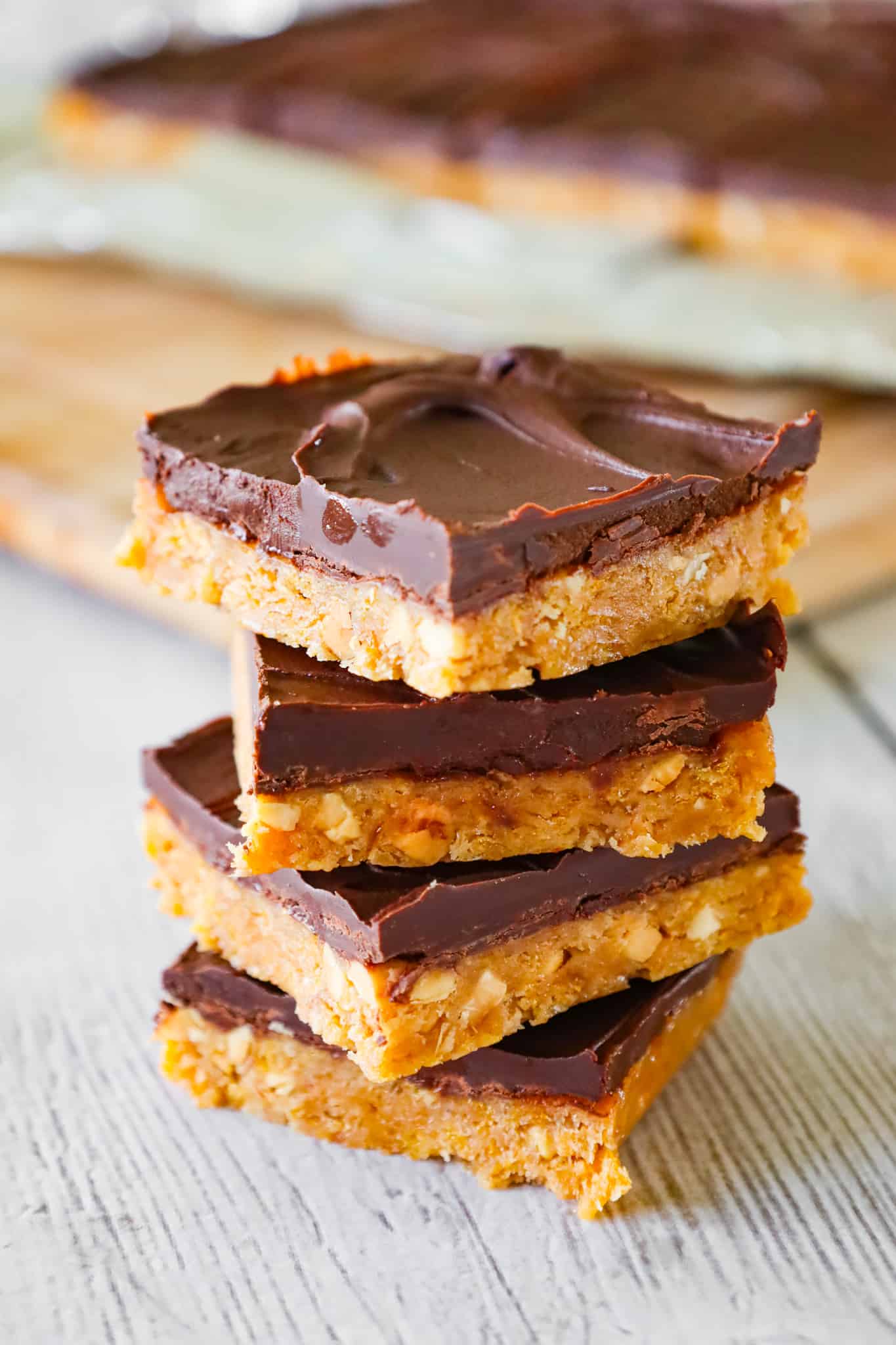 Peanut Butter Cornflake Bars are a decadent chocolate peanut butter dessert recipe made with corn syrup, crunchy peanut butter, crumbled cornflakes cereal and semi sweet chocolate chips.