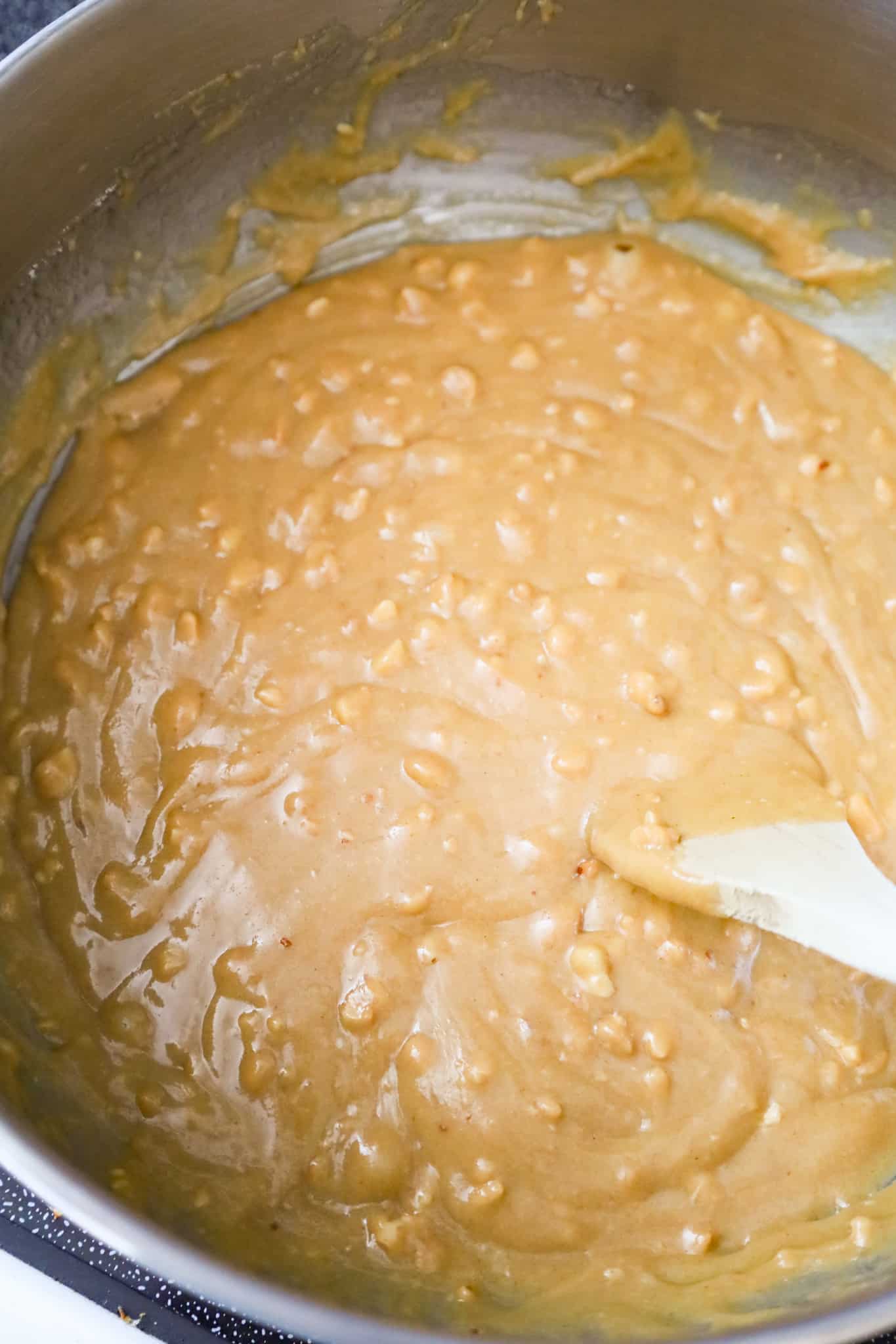melted peanut butter, sugar and corn syrup mixture in a pot
