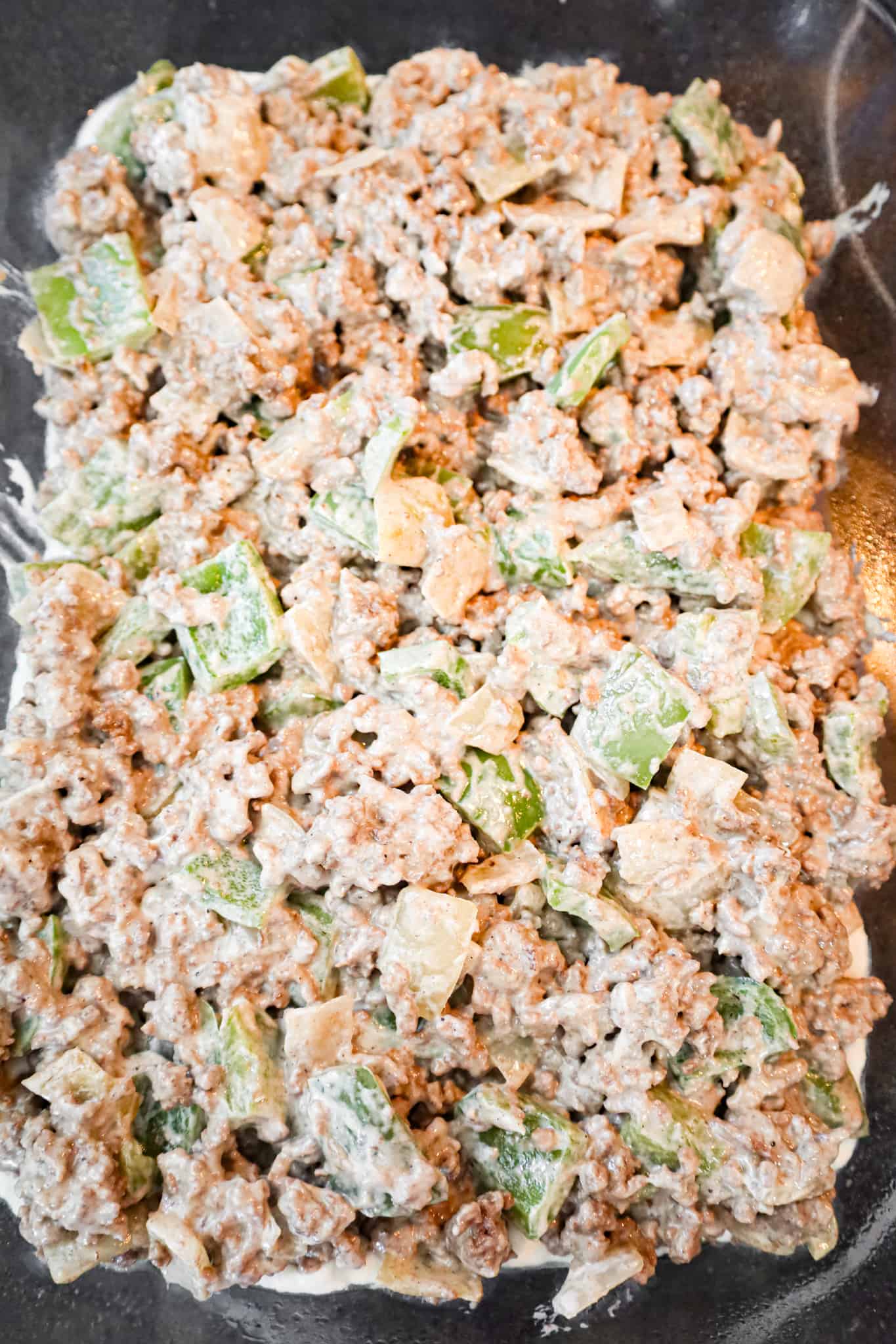 ground beef, peppers and onions mixture in a baking dish