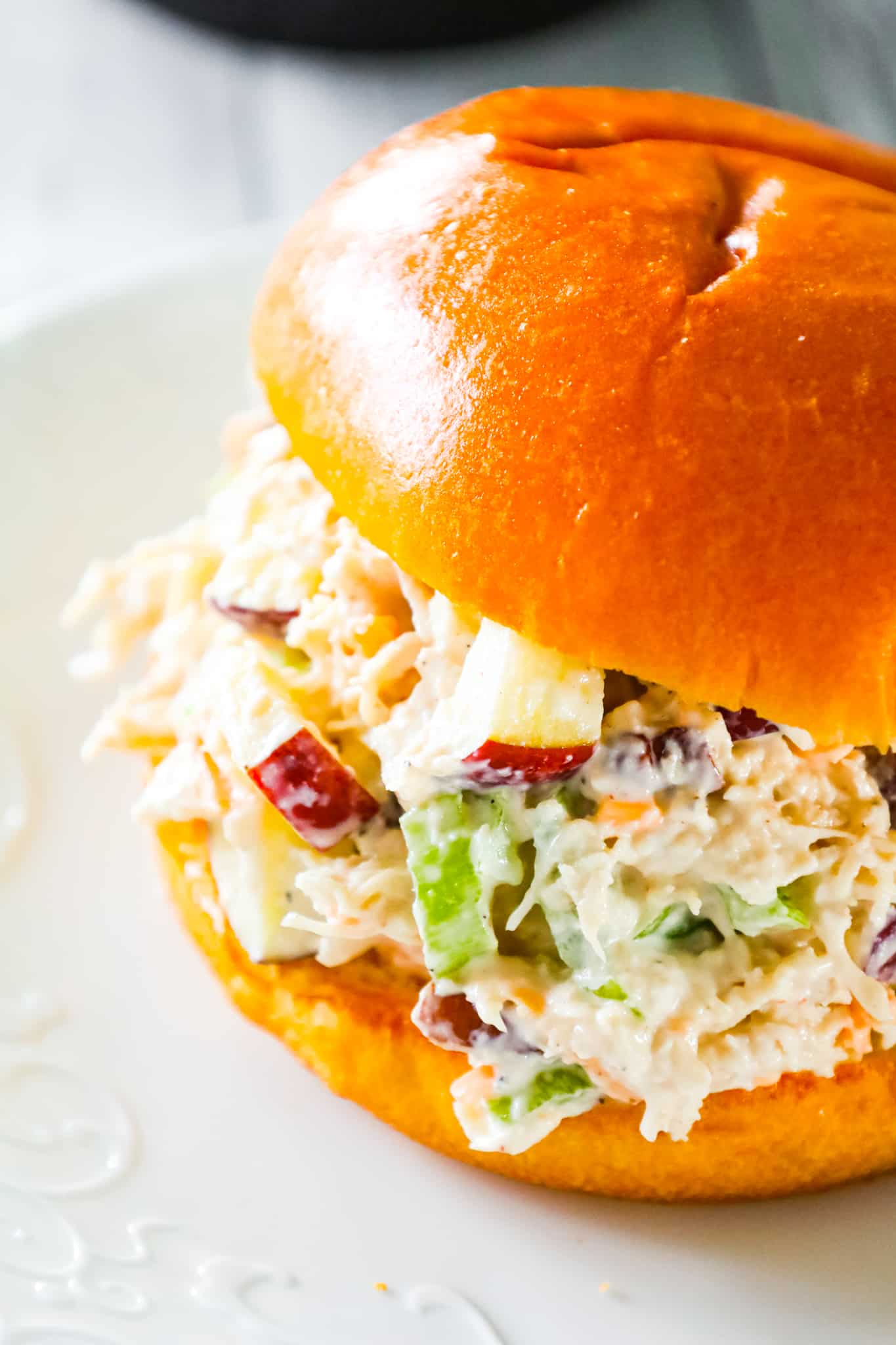 Chicken Salad with Apples is tasty lunch or dinner recipe using shredded rotisserie chicken and loaded with mayo, celery, diced apples, pecans and shredded cheddar.