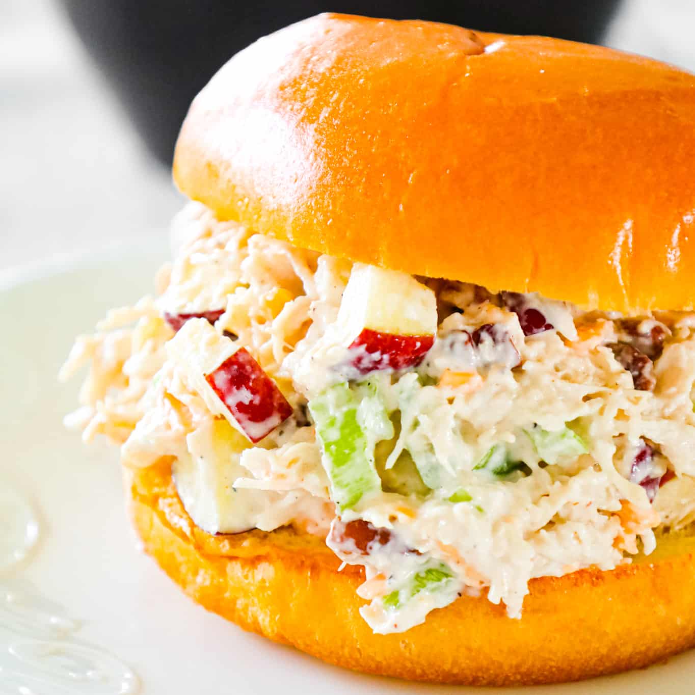 Chicken Salad with Apples is tasty lunch or dinner recipe using shredded rotisserie chicken and loaded with mayo, celery, diced apples, pecans and shredded cheddar.