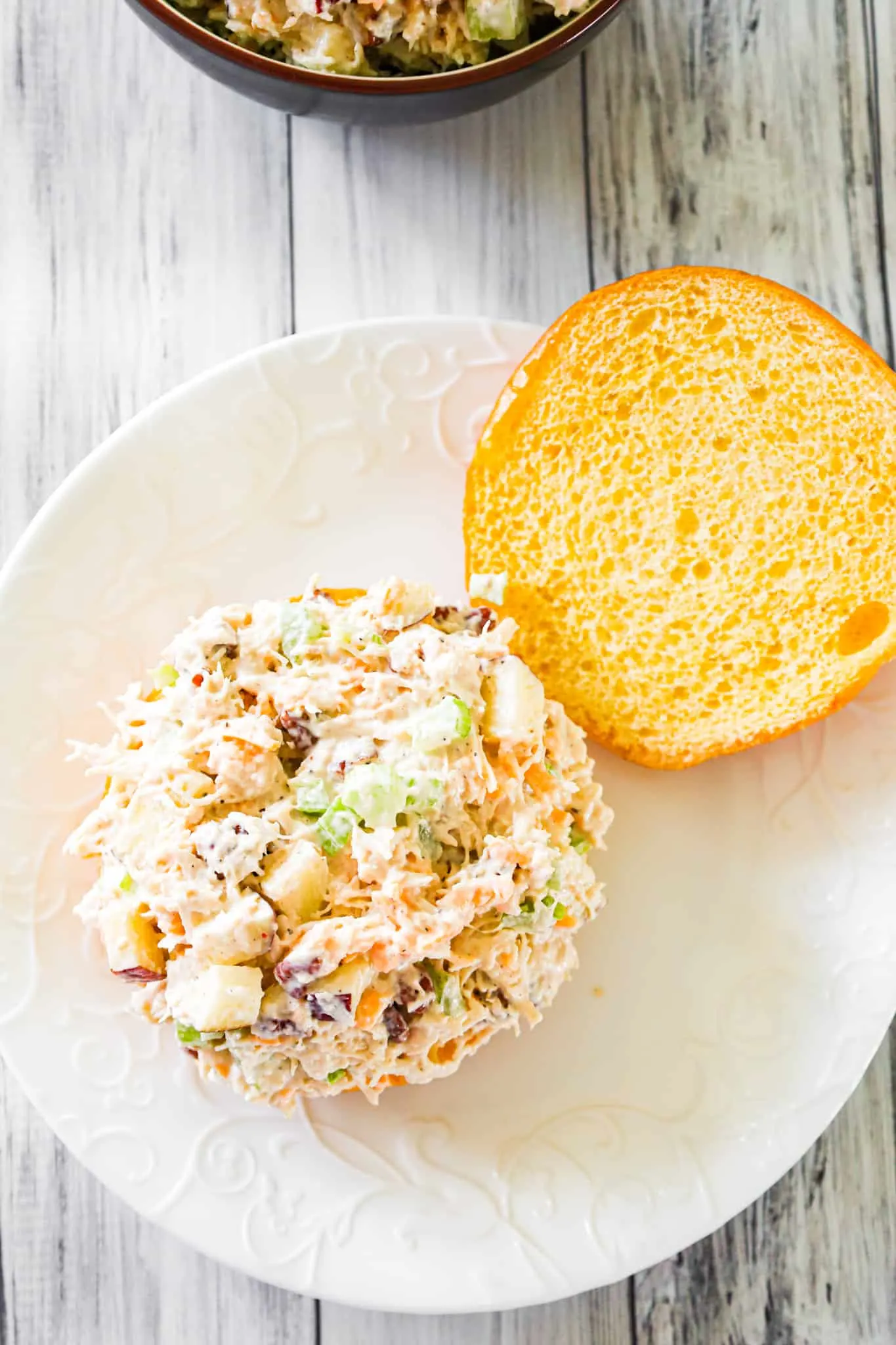 Chicken Salad with Apples is tasty lunch or dinner recipe using shredded rotisserie chicken and loaded with mayo, celery, diced apples, pecans and shredded cheddar.