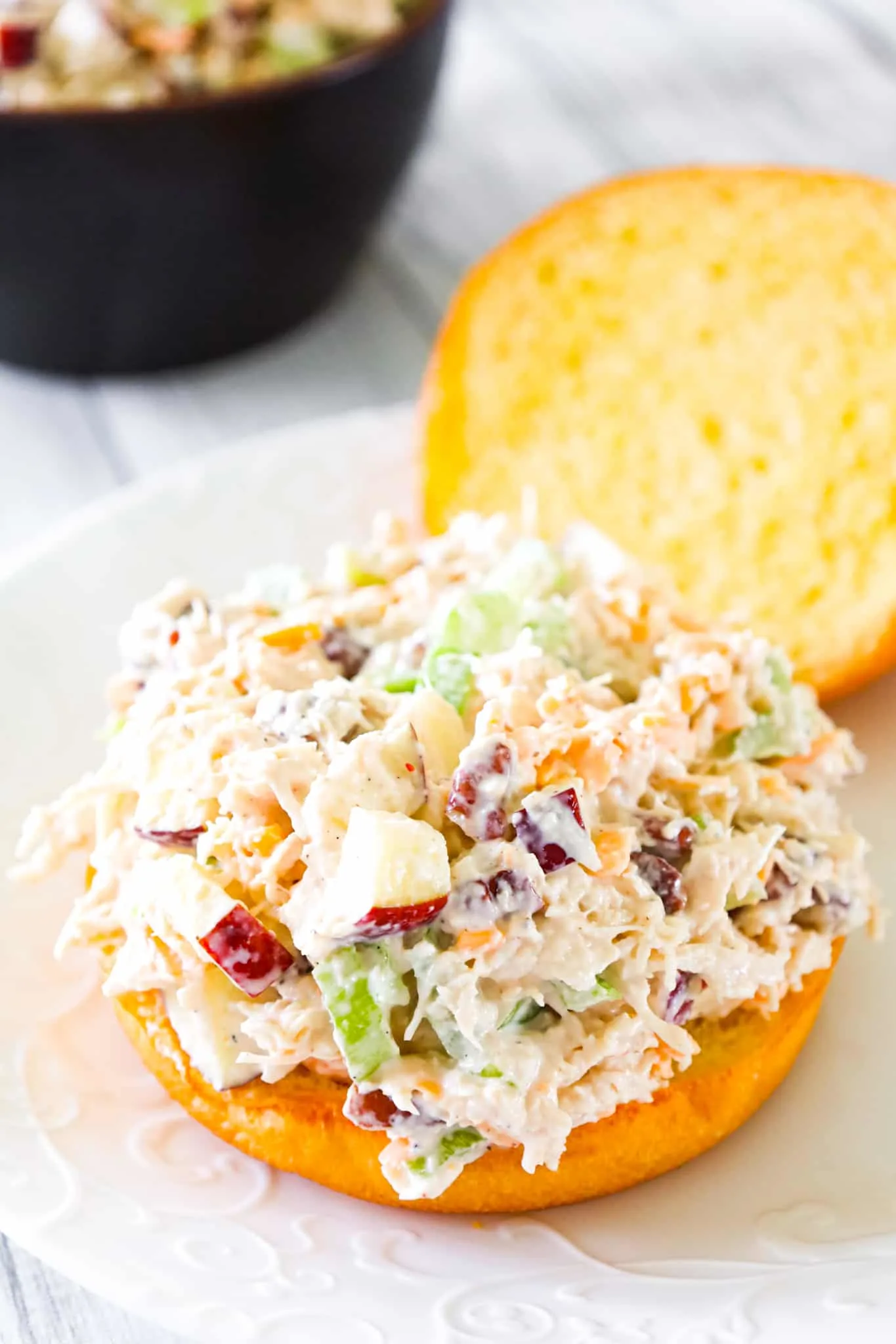 Chicken Salad with Apples is tasty lunch or dinner recipe using shredded rotisserie chicken and loaded with mayo, celery, diced apples, pecans and shredded cheddar.