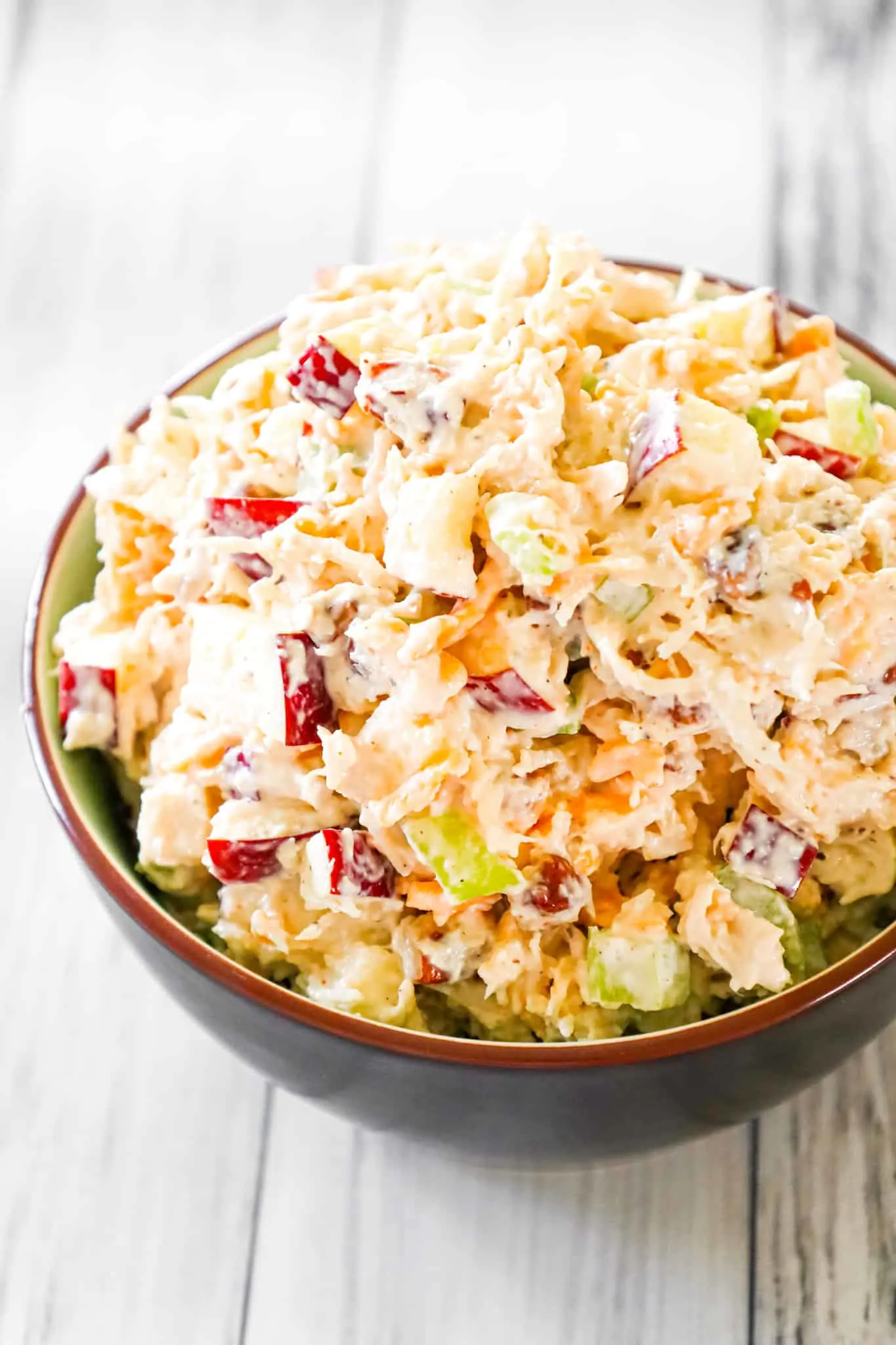 Chicken Salad with Apples is tasty lunch or dinner recipe using shredded rotisserie chicken and loaded with mayo, celery, diced apples, pecans and shredded cheddar.