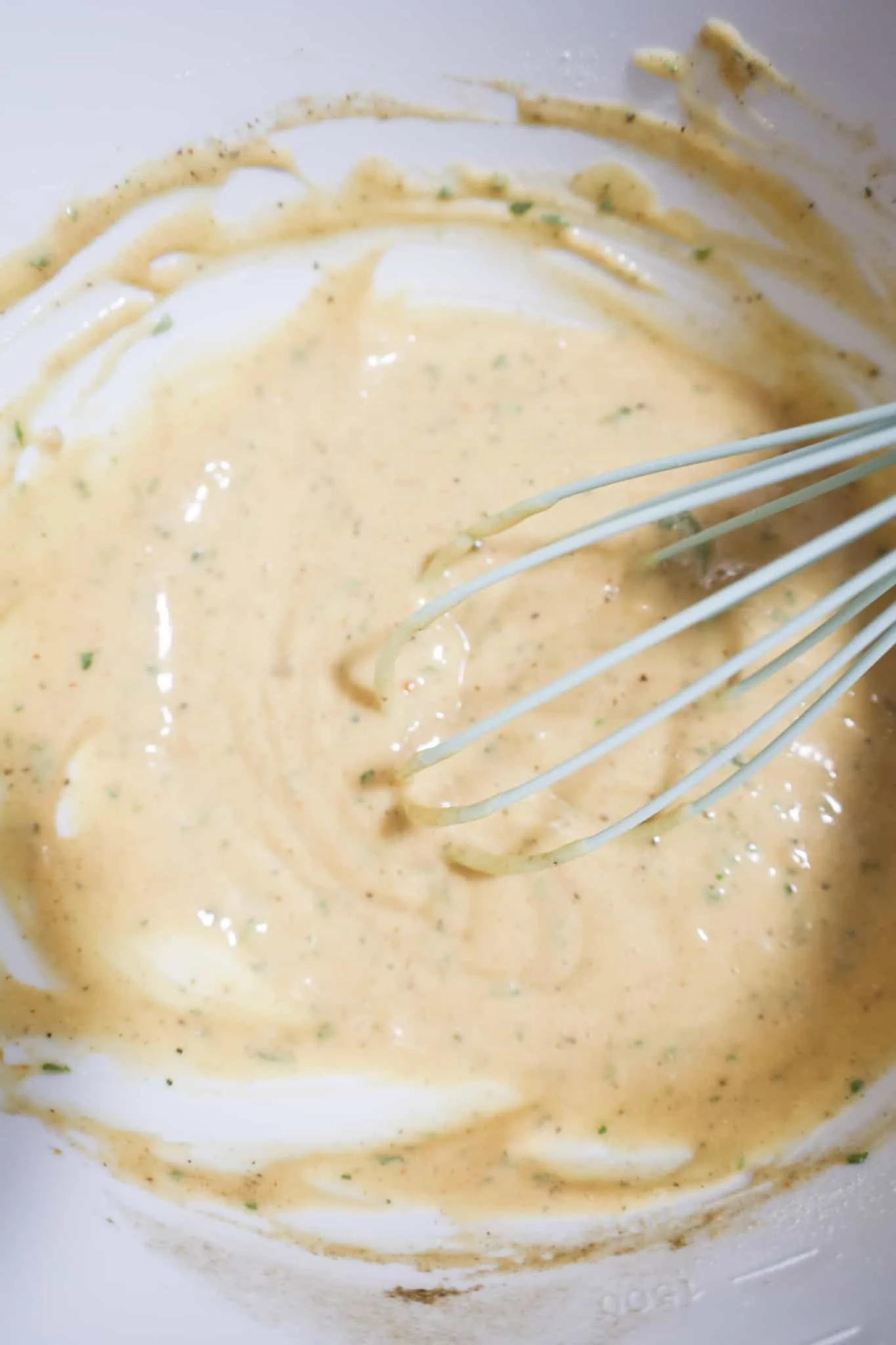 cream of chicken soup and gravy mix whisked together in a mixing bowl