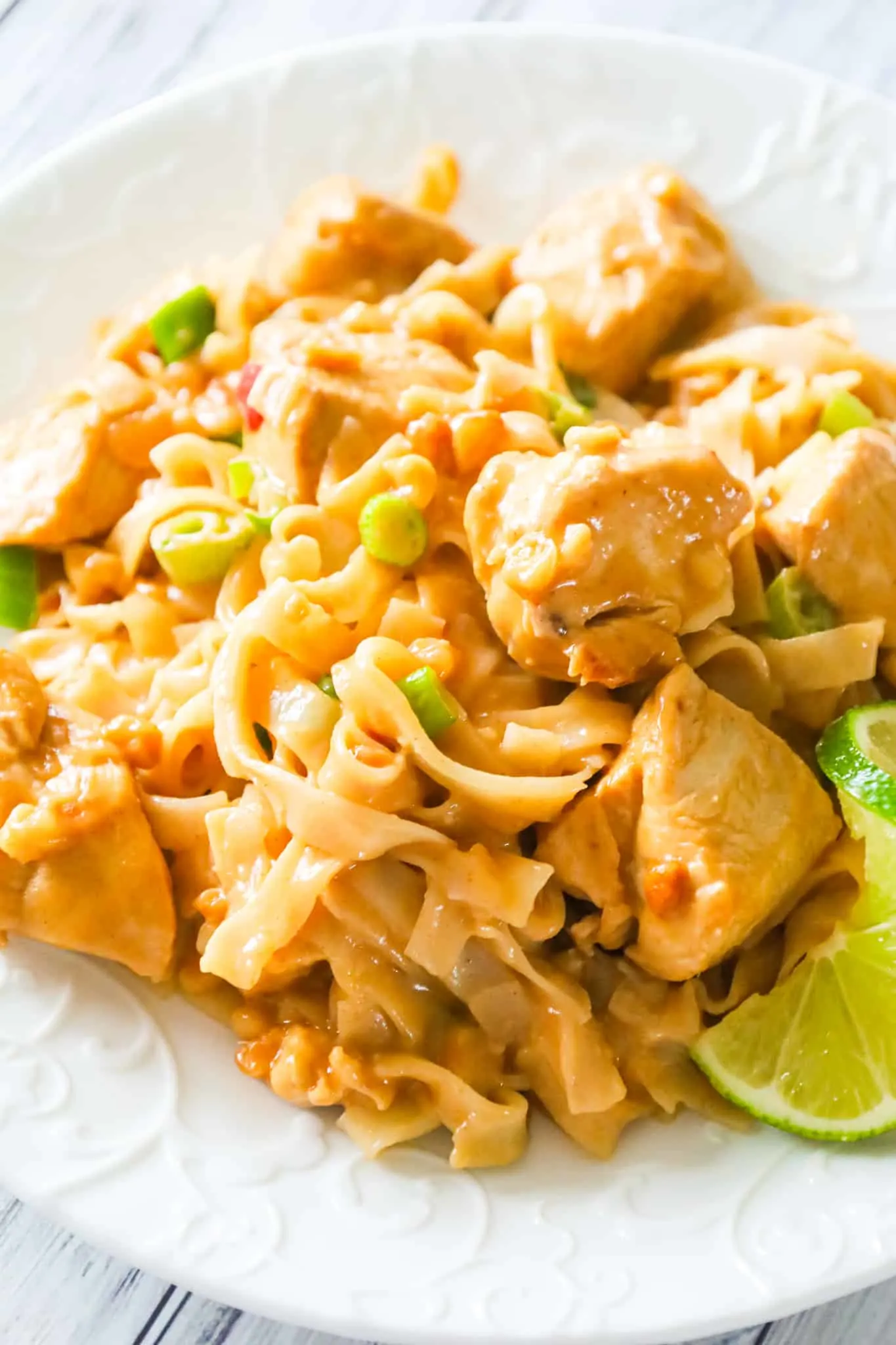 Peanut Butter Chicken is an easy dinner recipe made with boneless, skinless chicken breast chunks and rice stick noodles all tossed in sauce made from coconut milk, soy sauce, lime juice, Thai chili sauce and peanut butter.