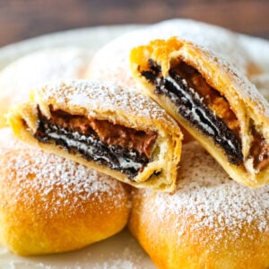 Air Fryer Oreos are a fun twist on deep fried Oreos. These tasty treats are made with Oreo thins and Reese's peanut butter cup thins wrapped in Pillsbury crescent roll dough and air fried until golden brown.