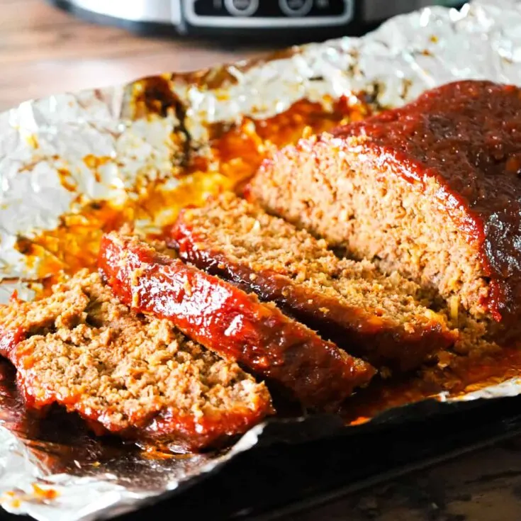 Crock Pot Meatloaf is an easy slow cooker ground beef meatloaf recipe made with crushed Ritz crackers and Lipton onion soup mix.