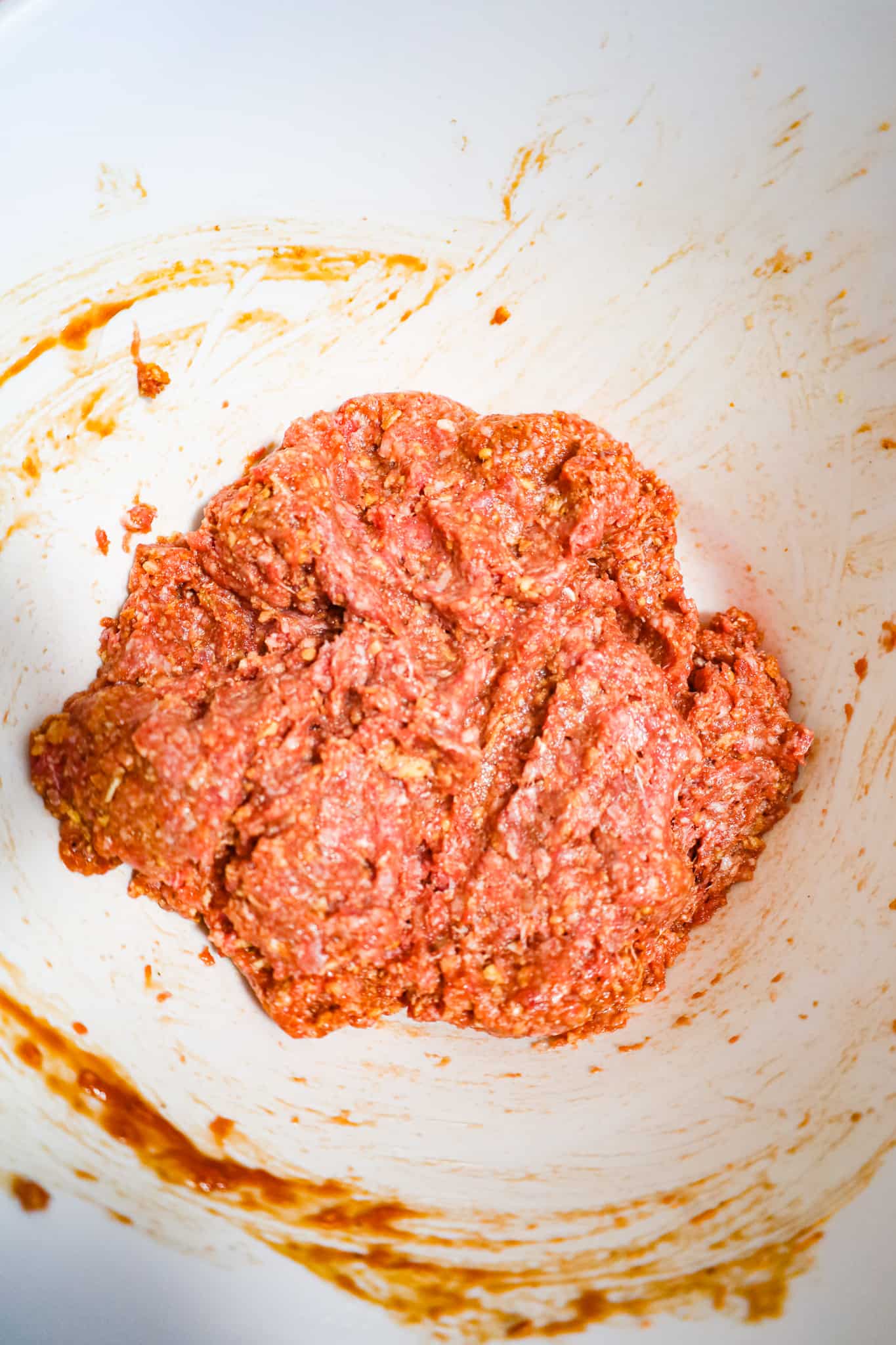 ground beef meatloaf mixture in a mixing bowl