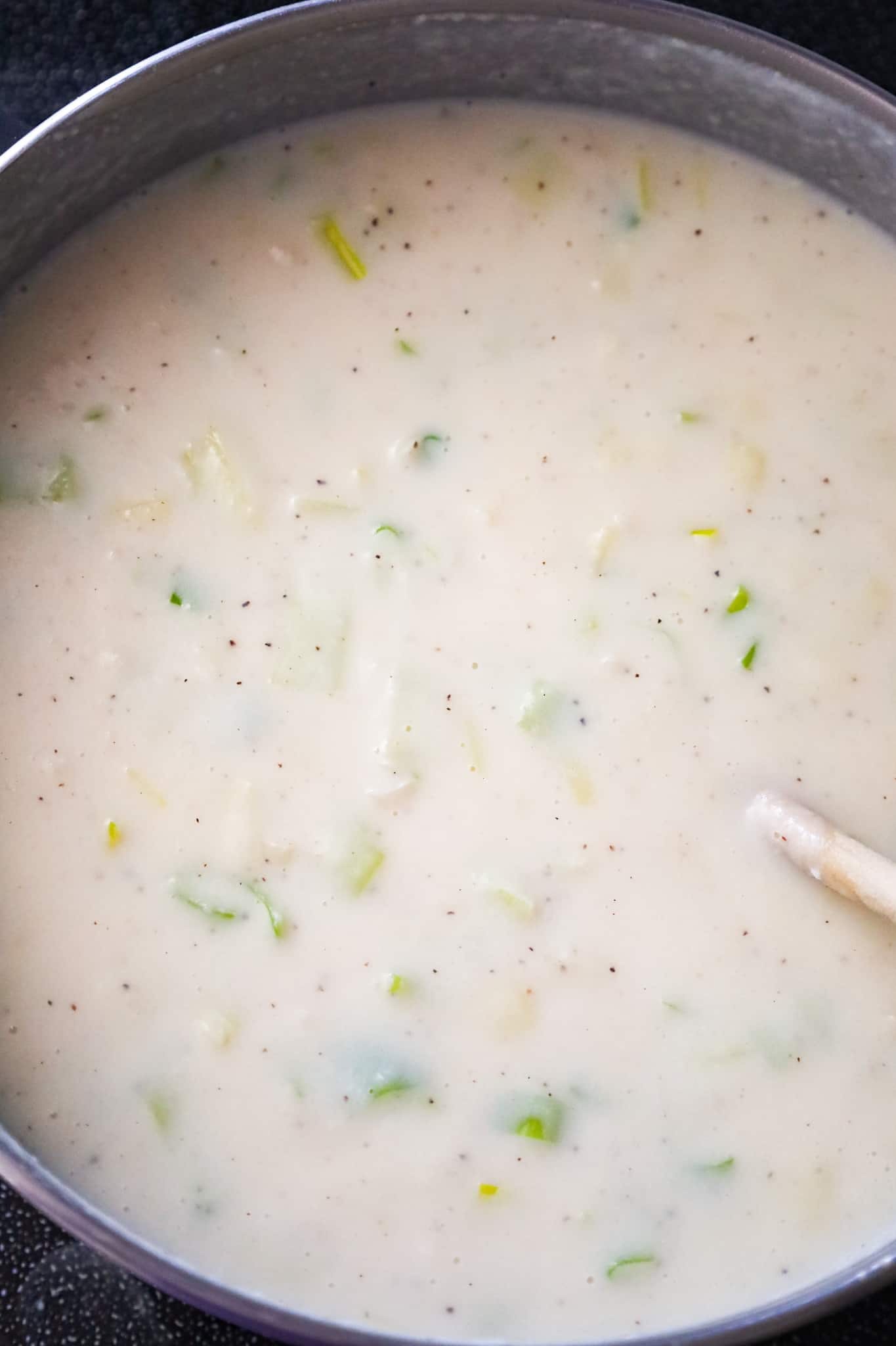 potato leek soup simmering in a pot