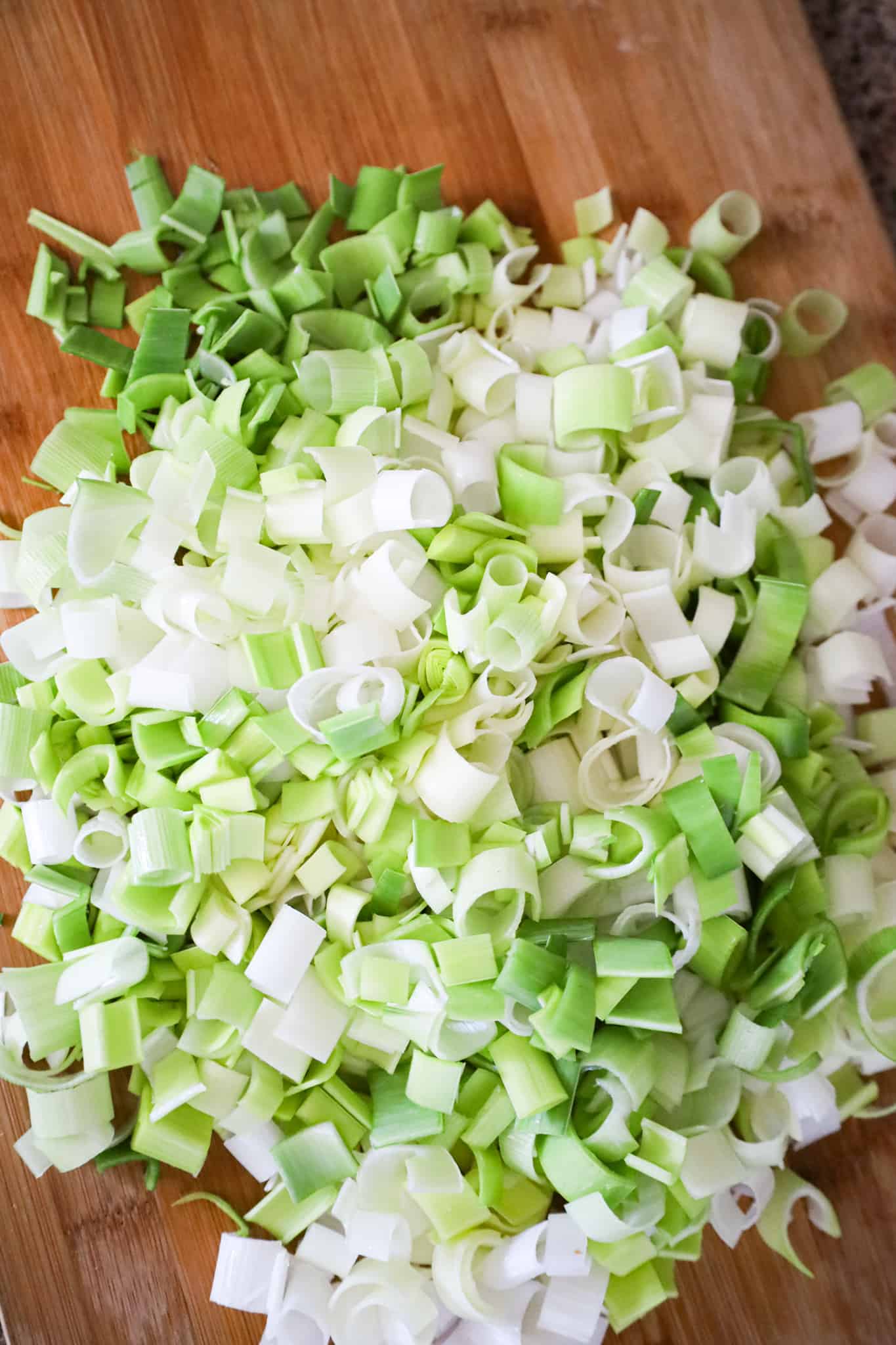 chopped leeks on a cutting board