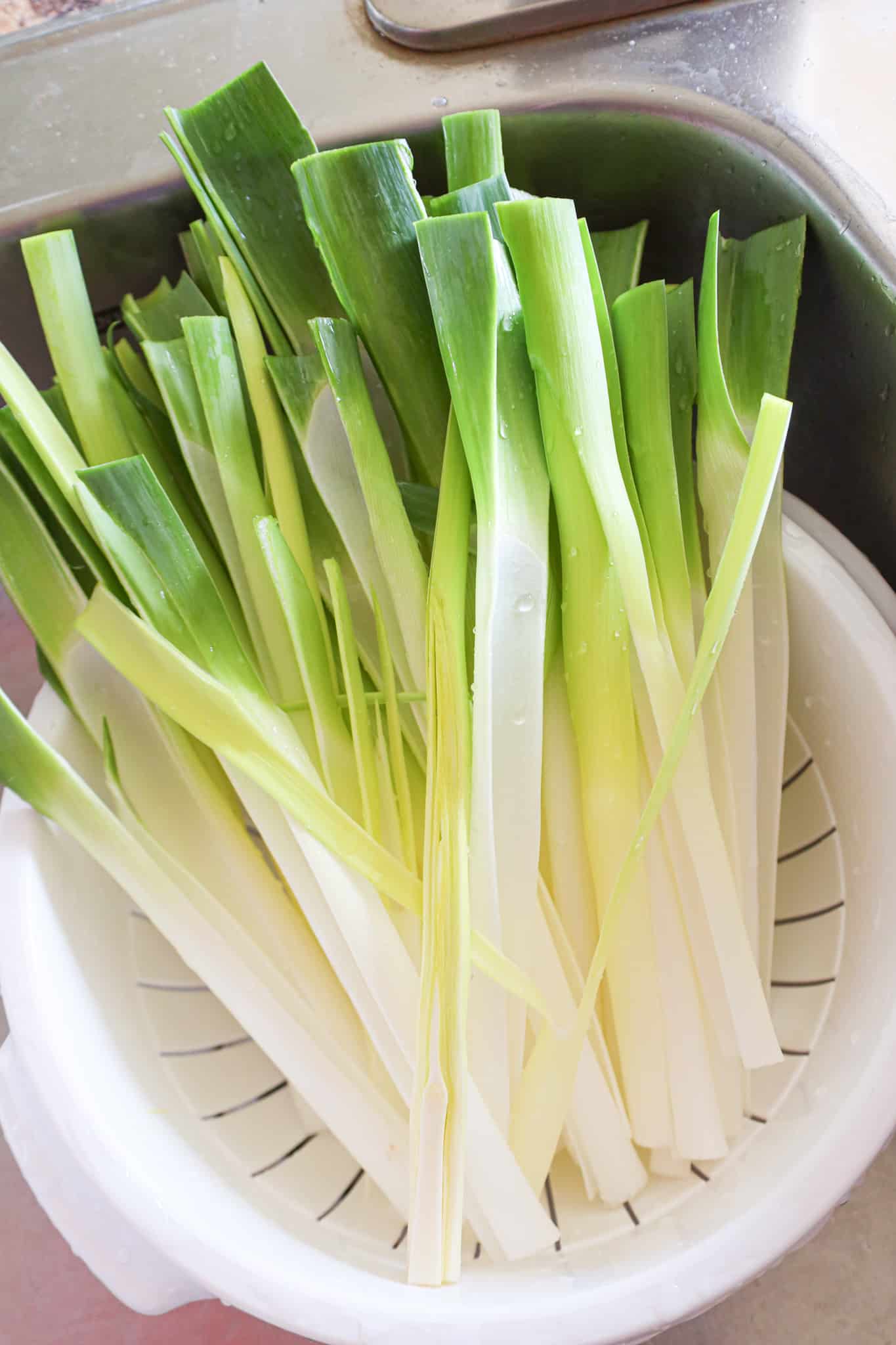 leek layers in a colander