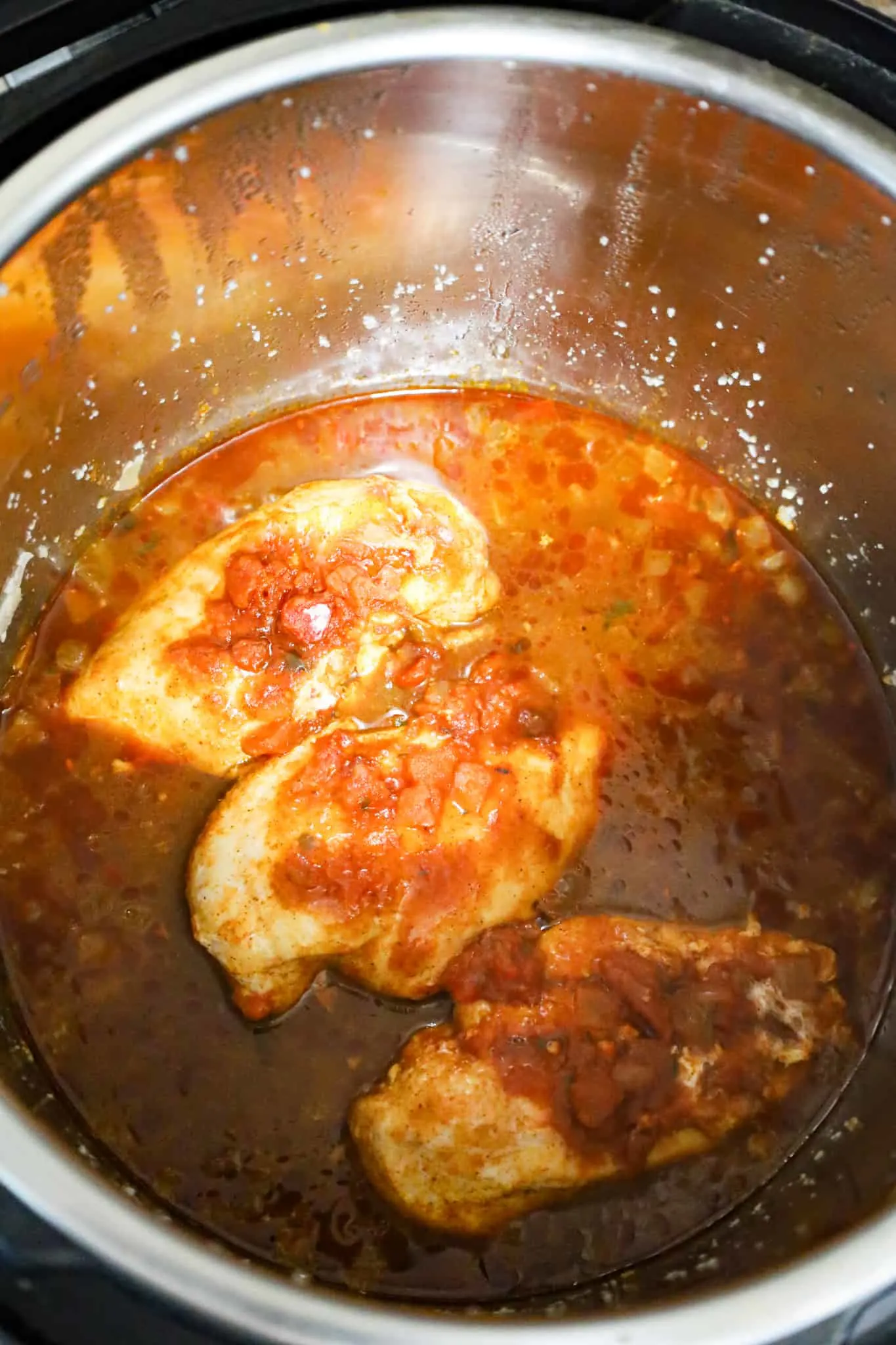 salsa covered chicken breasts in an Instant Pot after pressure cooking