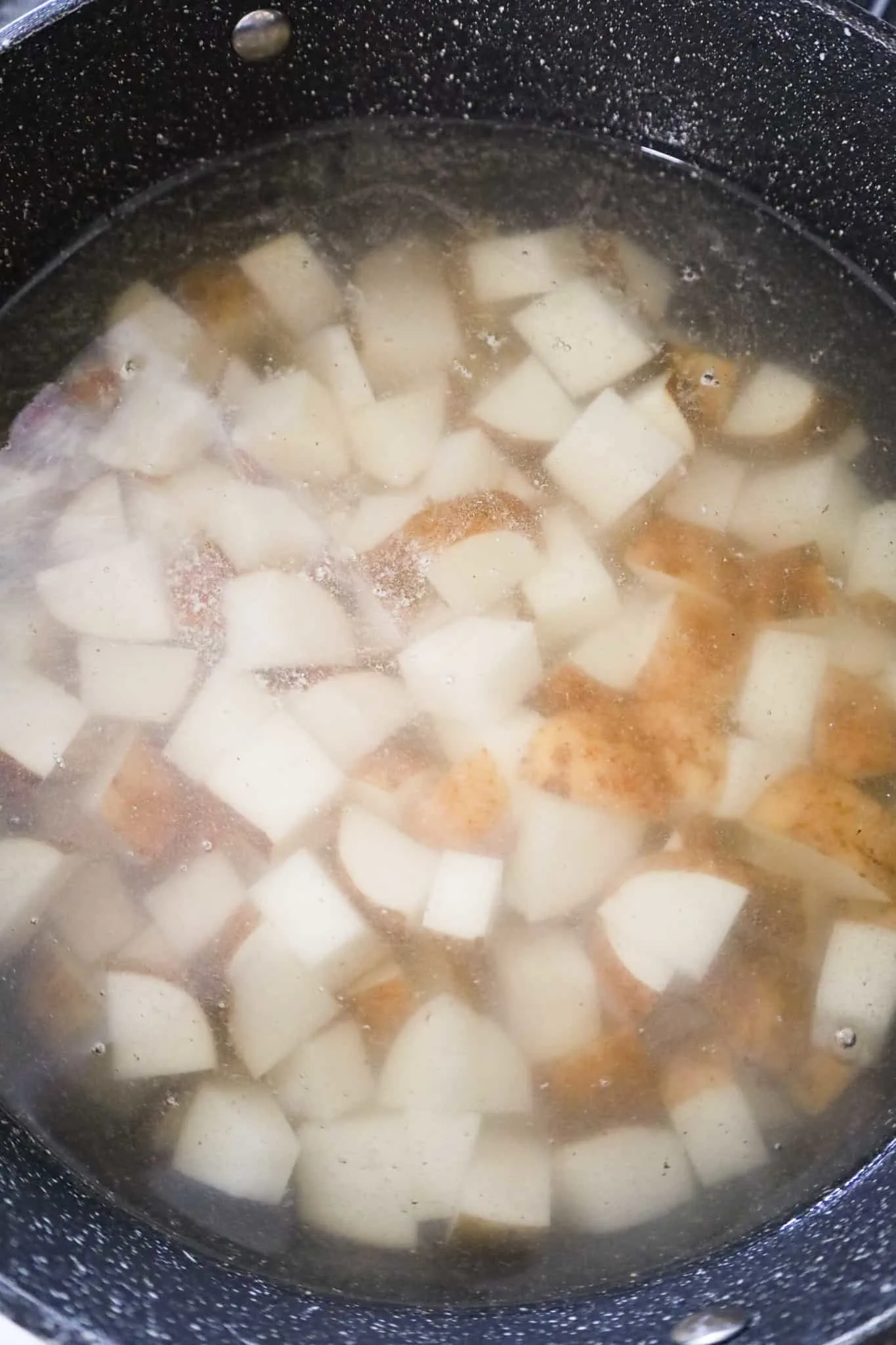 diced potatoes in a pot of water