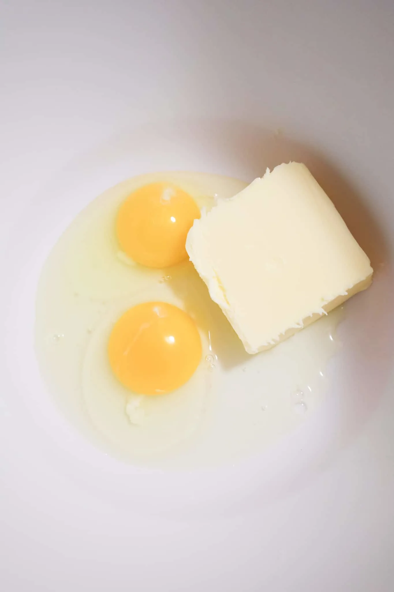 eggs and softened butter in a mixing bowl