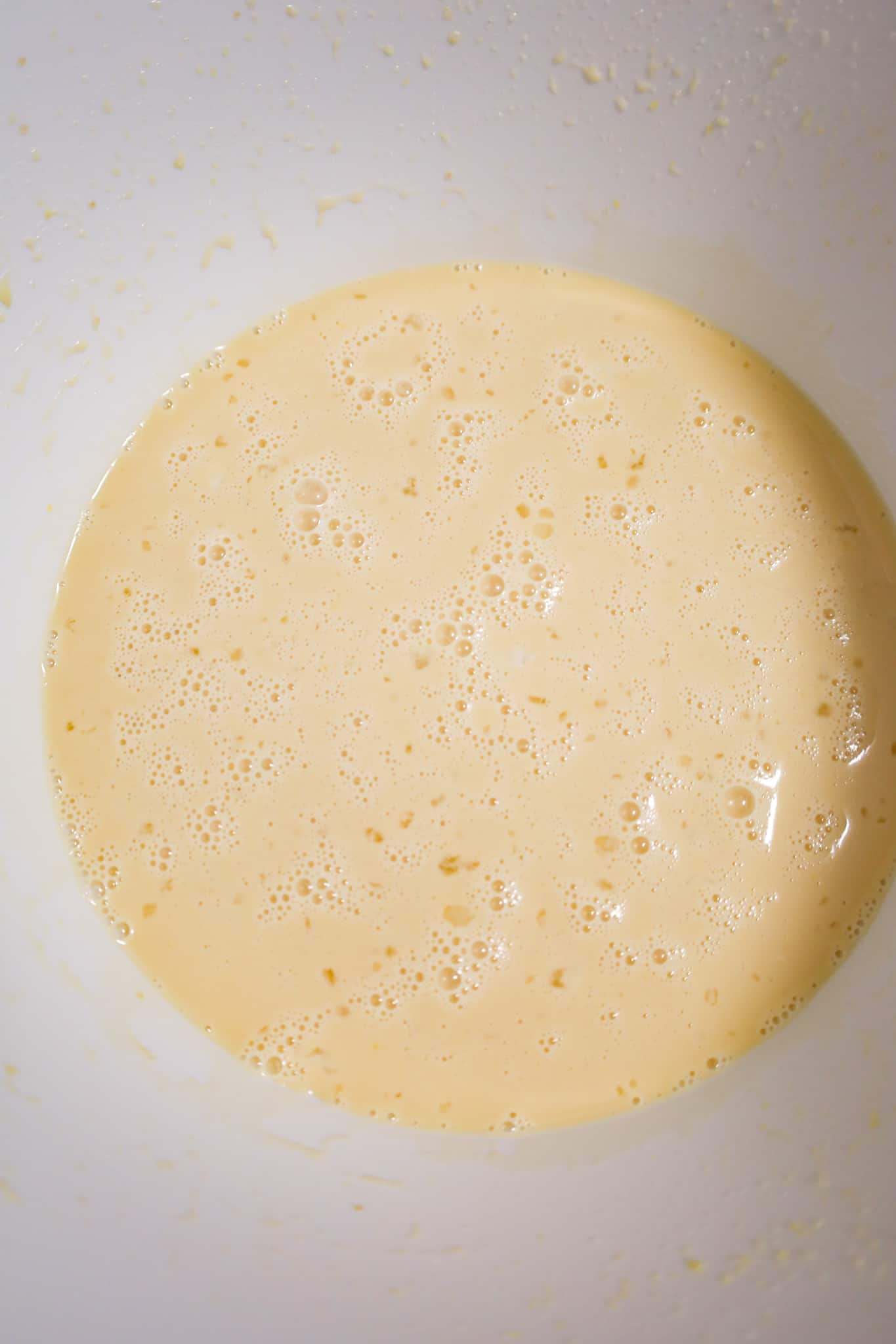 bread pudding custard mixture in a mixing bowl