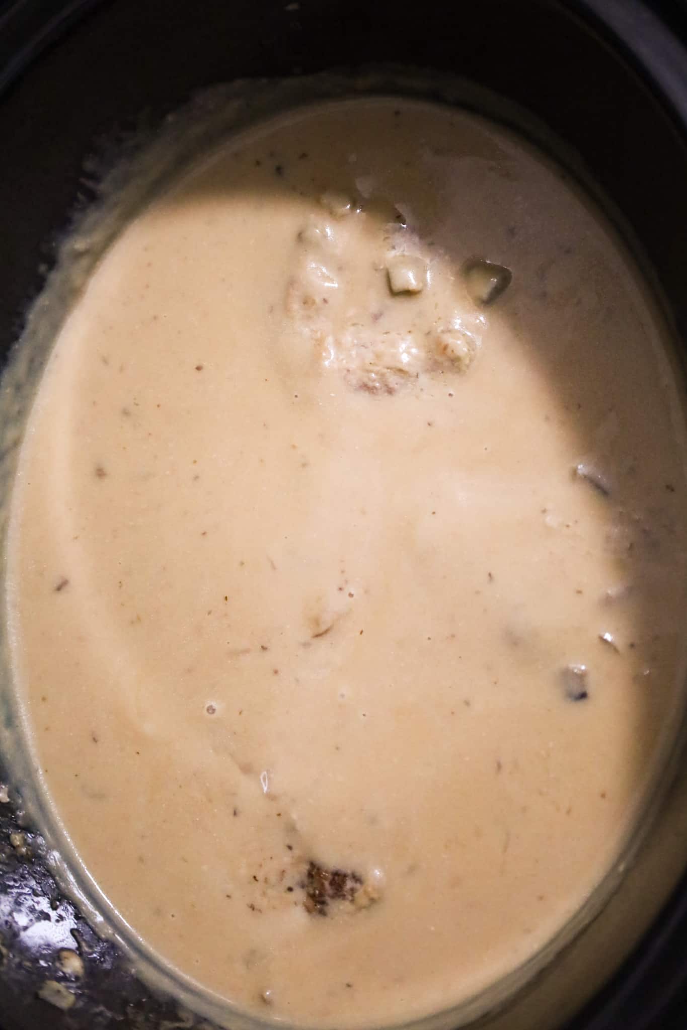 salisbury steak cooking in a crock pot