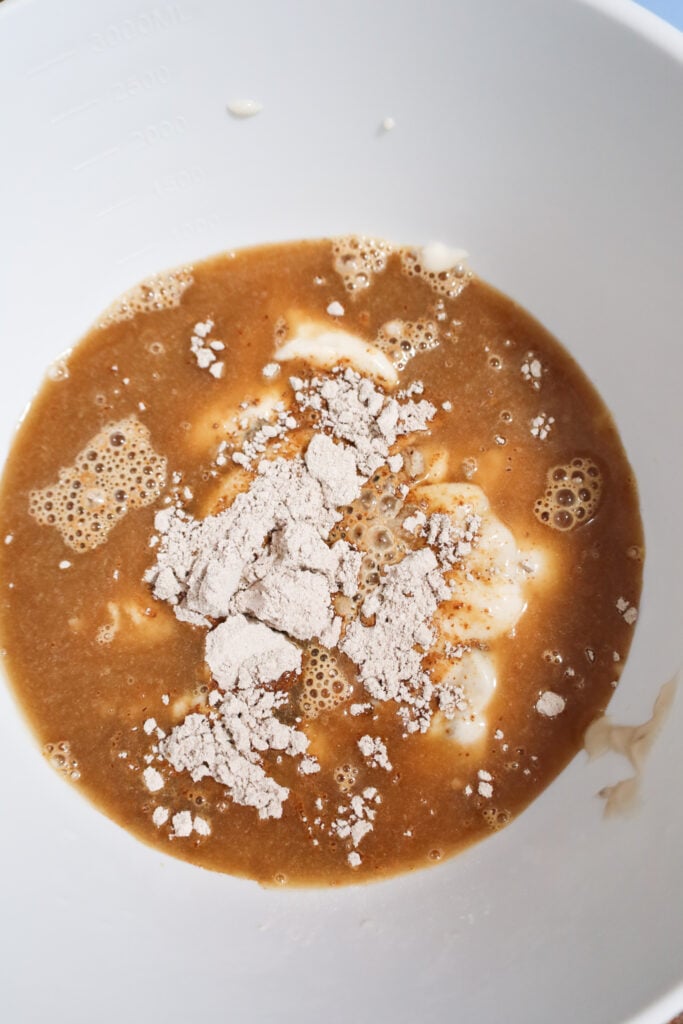 brown gravy mix, beef broth and condensed cream of mushroom soup in a mixing bowl