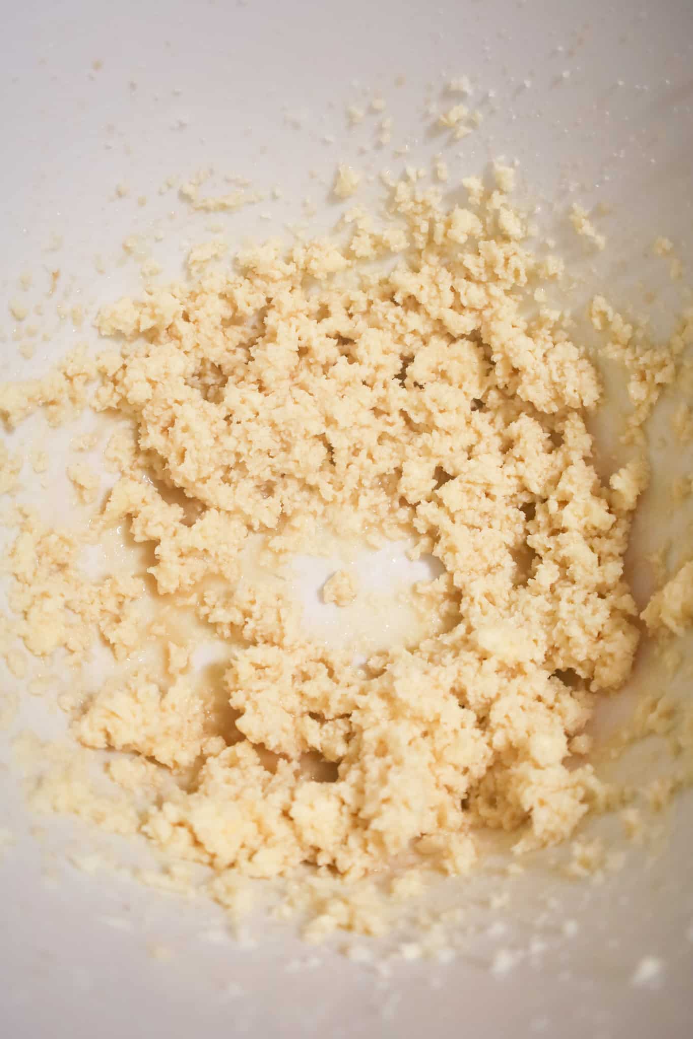 butter, sugar, vanilla and milk mixture in a mixing bowl