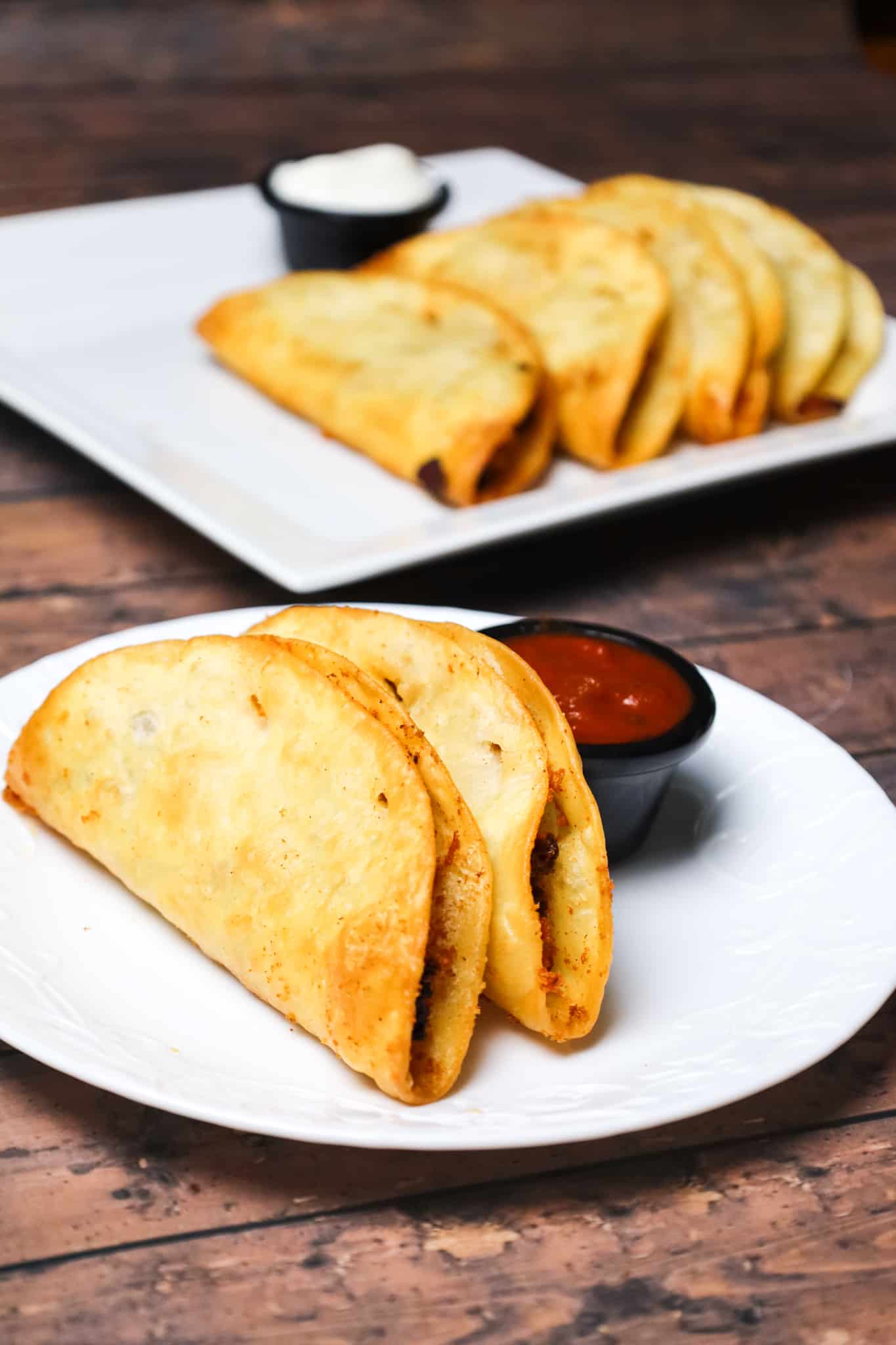 Fried Tacos are an easy ground beef dinner recipe using flour tortillas filled with taco beef and shredded cheese before frying.