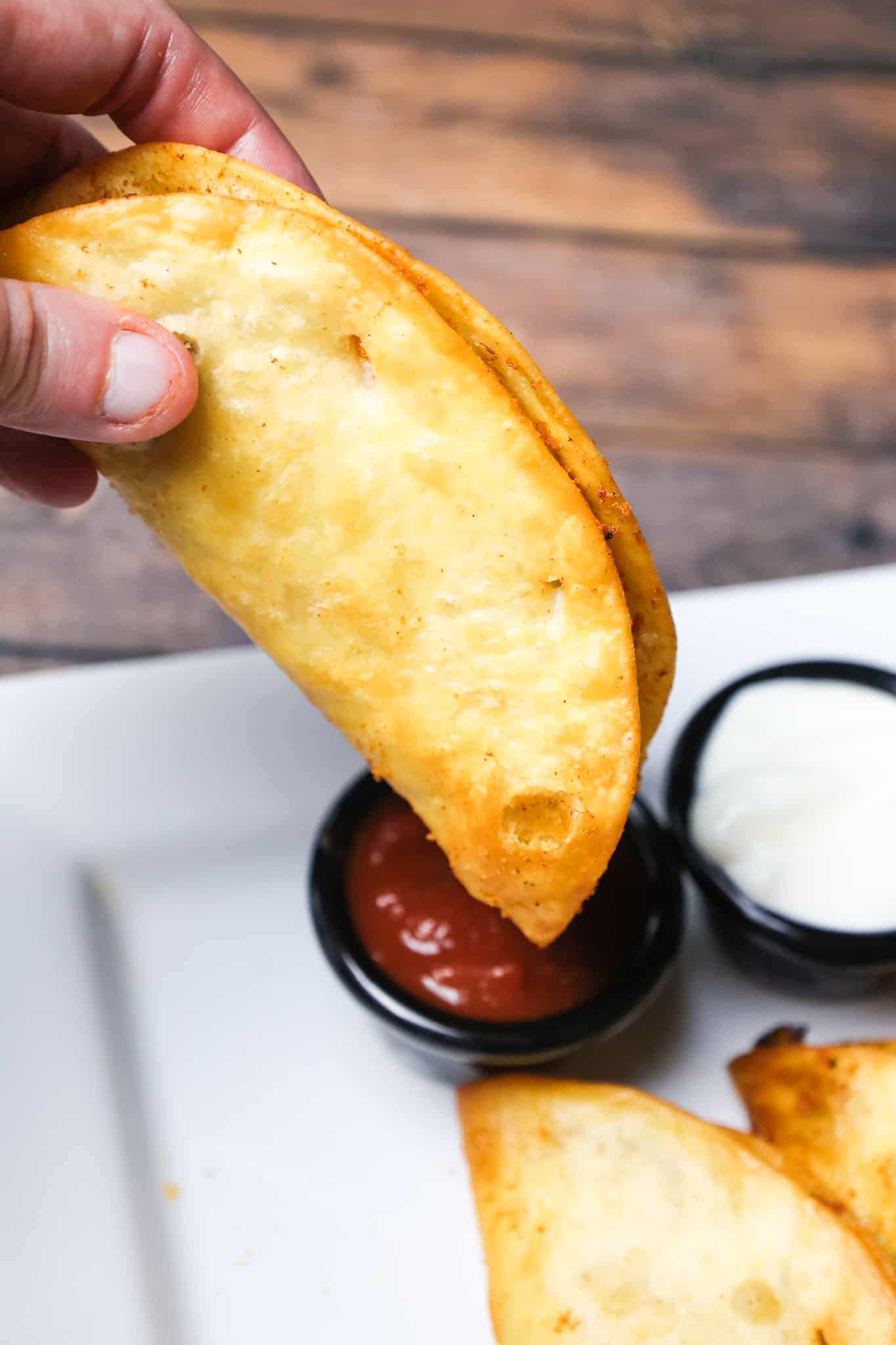 Fried Tacos are an easy ground beef dinner recipe using flour tortillas filled with taco beef and shredded cheese before frying.