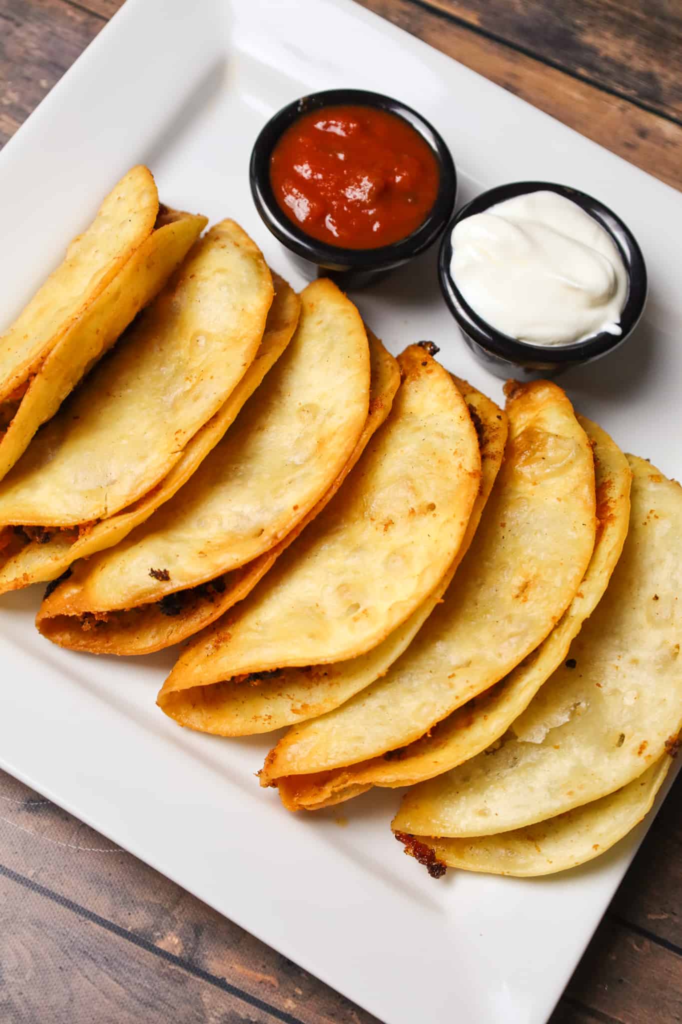 Fried Tacos are an easy ground beef dinner recipe using flour tortillas filled with taco beef and shredded cheese before frying.