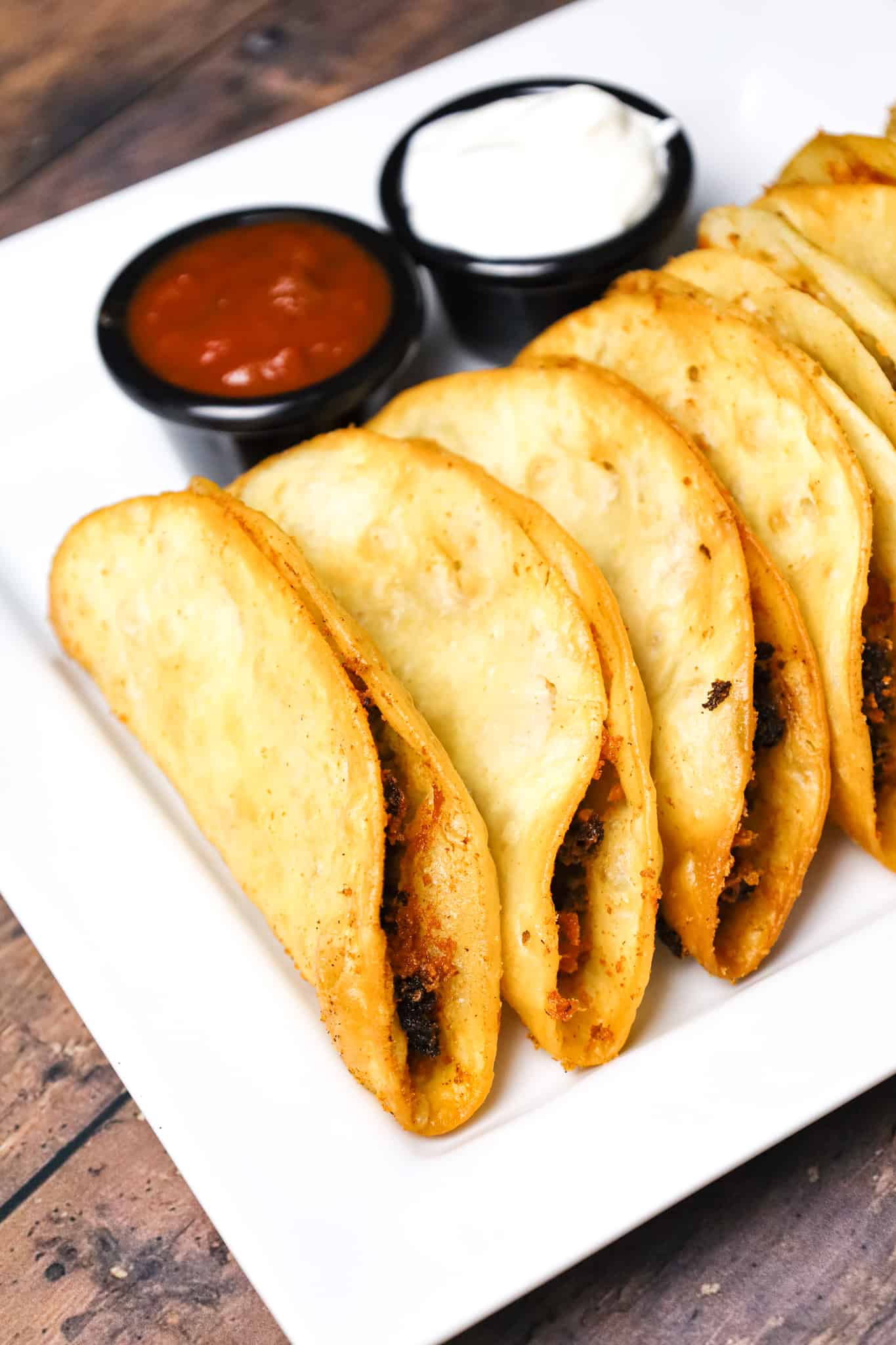 Fried Tacos are an easy ground beef dinner recipe using flour tortillas filled with taco beef and shredded cheese before frying.