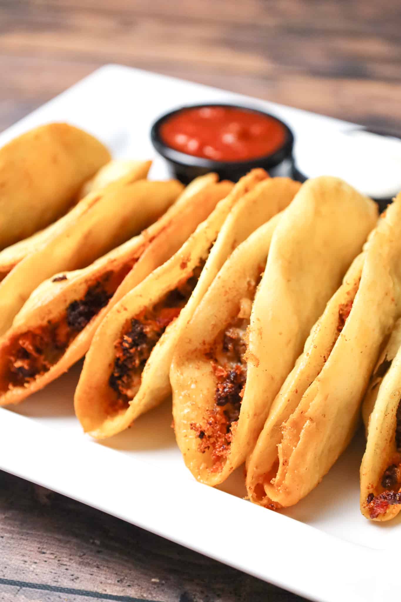 Fried Tacos are an easy ground beef dinner recipe using flour tortillas filled with taco beef and shredded cheese before frying.