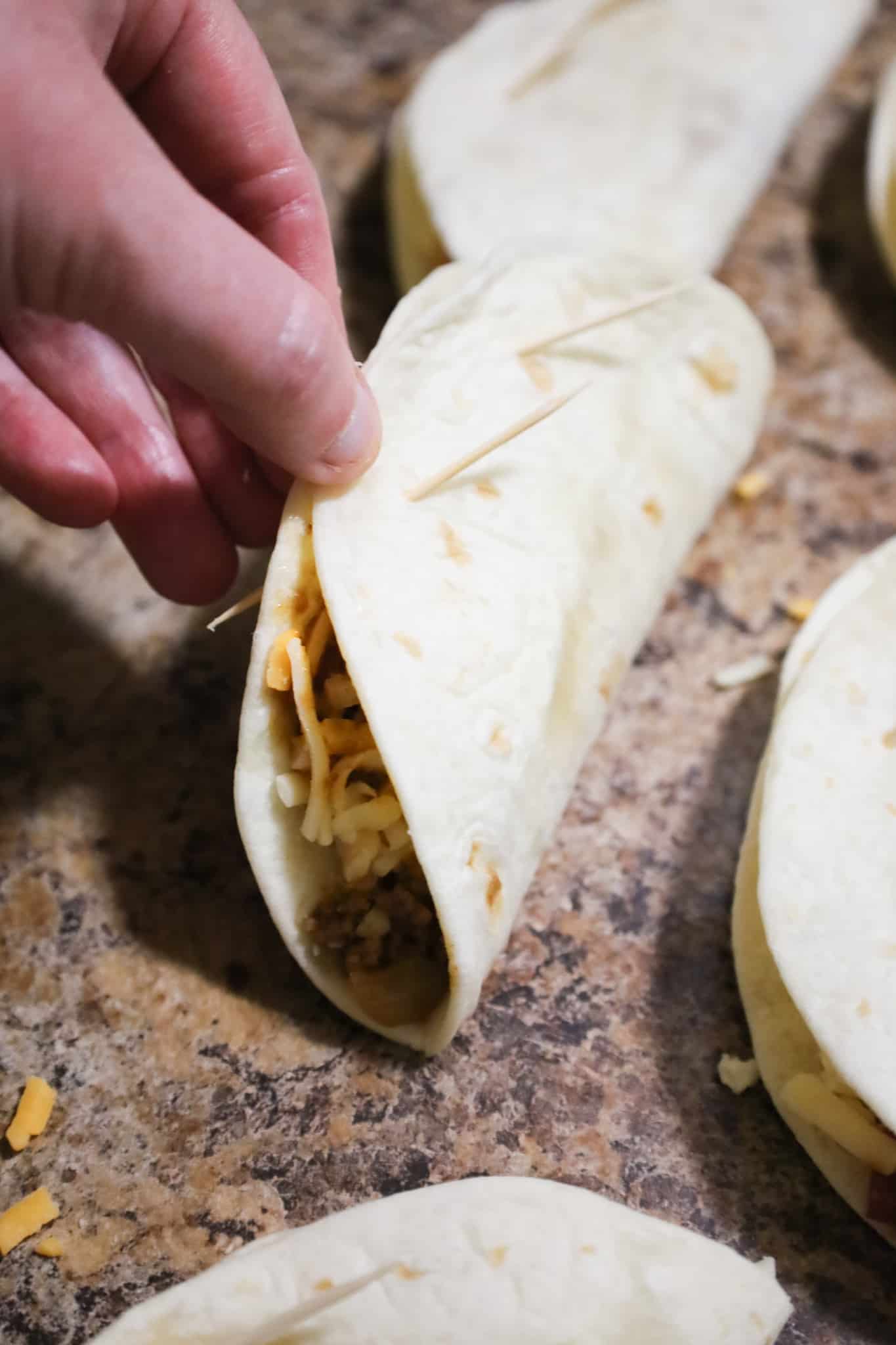 flour tortilla taco held together with two toothpicks