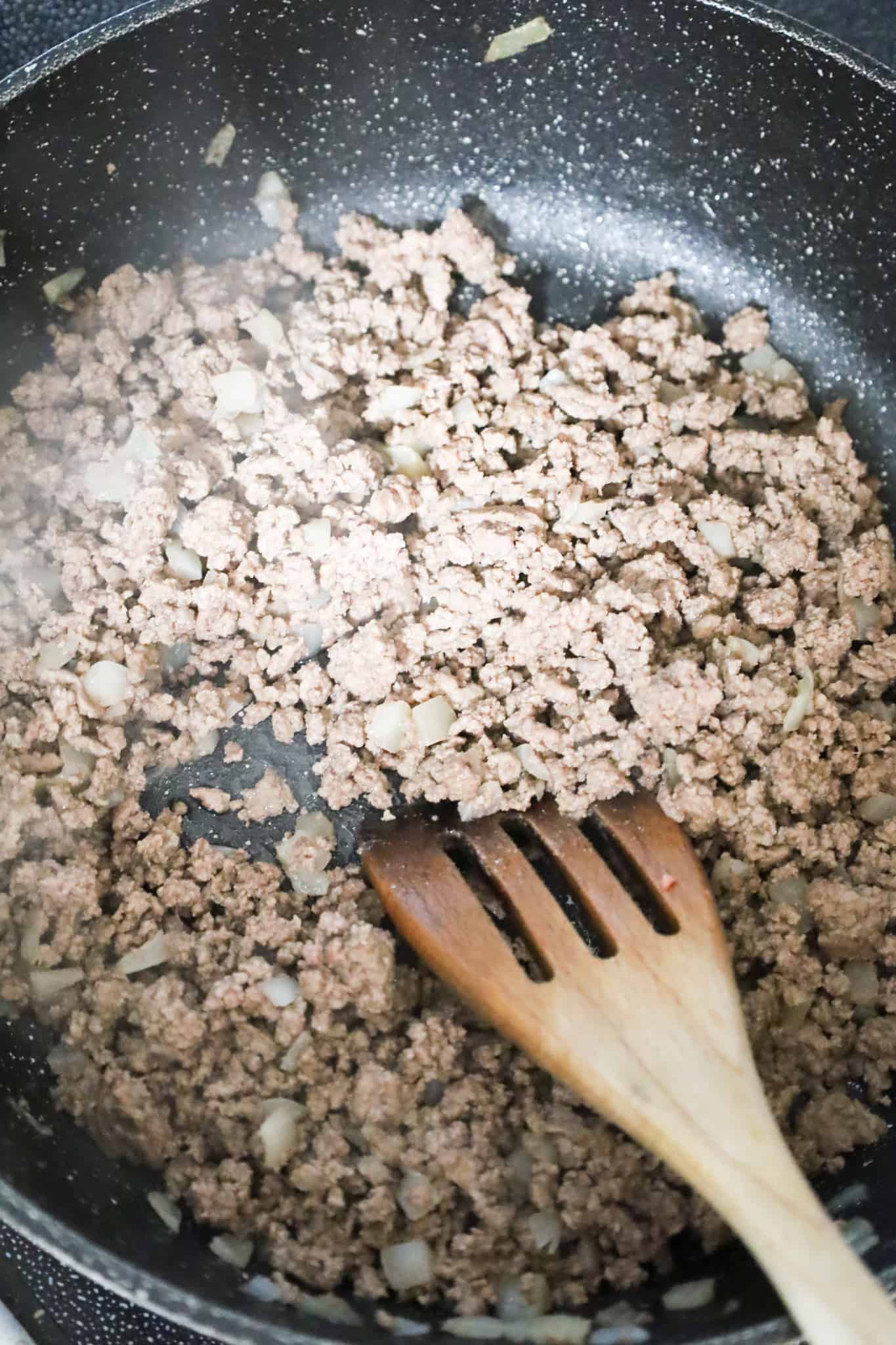 cooked ground beef in a saute pan