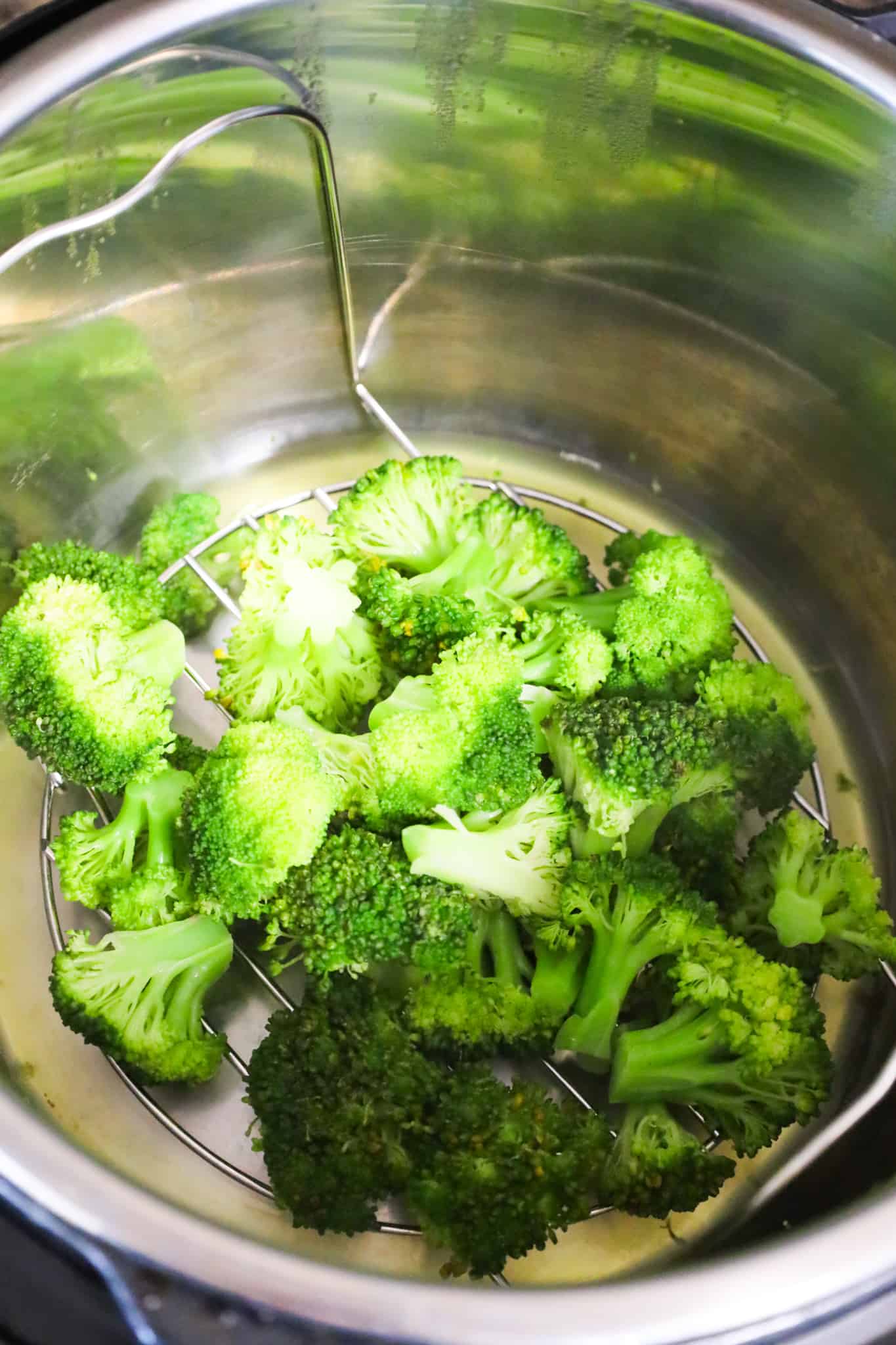 cooked broccoli on top of trivet in an Instant Pot