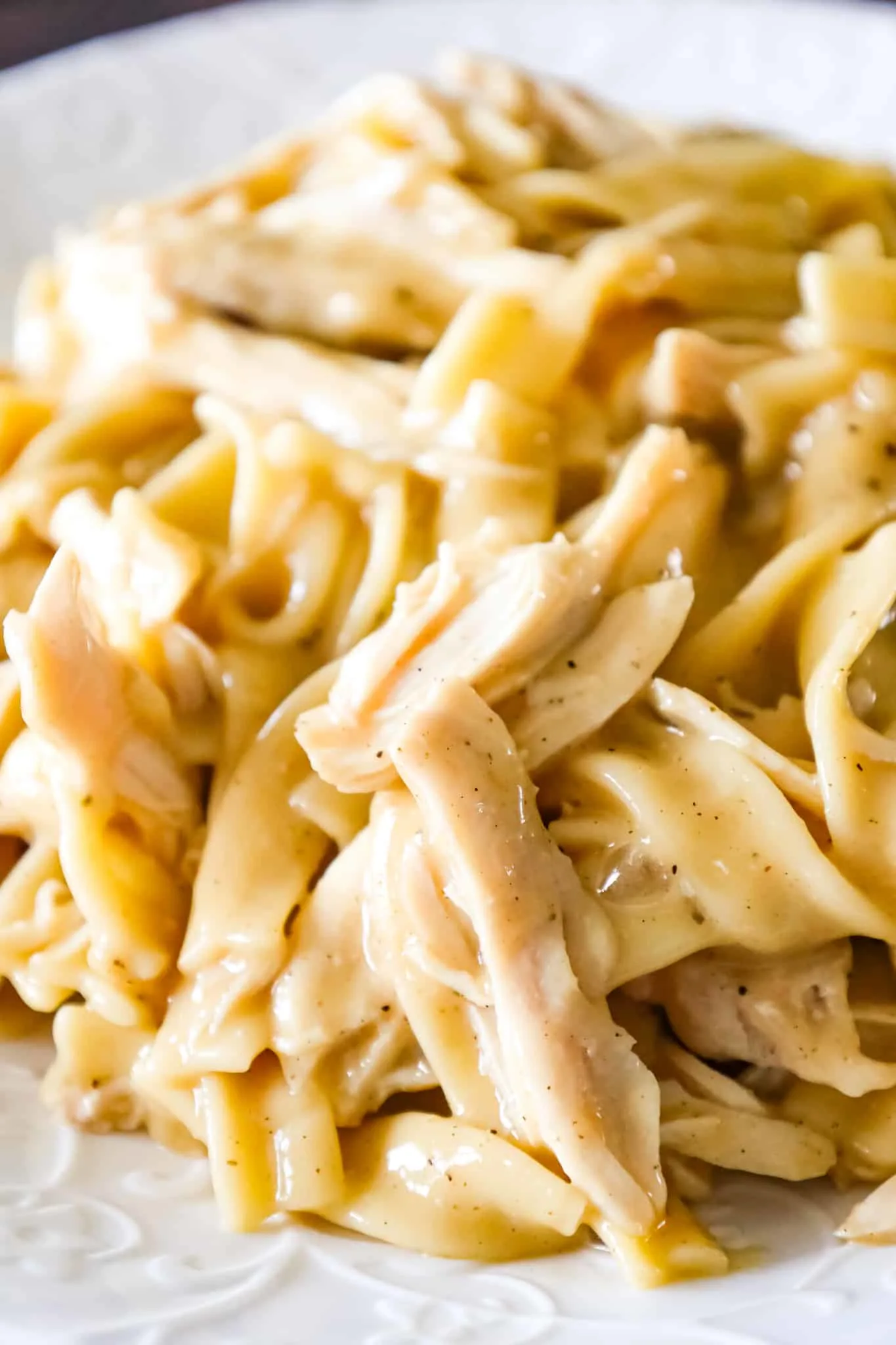 Instant Pot Chicken and Noodles is an easy pressure cooker dinner recipe using boneless, skinless chicken breasts and egg noodles in a sauce made with chicken broth, cream of chicken soup and chicken gravy mix.