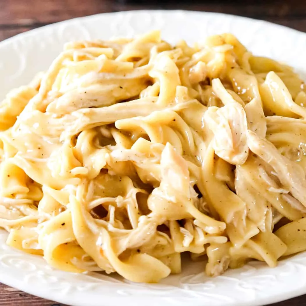 Instant Pot Chicken and Noodles is an easy pressure cooker dinner recipe using boneless, skinless chicken breasts and egg noodles in a sauce made with chicken broth, cream of chicken soup and chicken gravy mix.