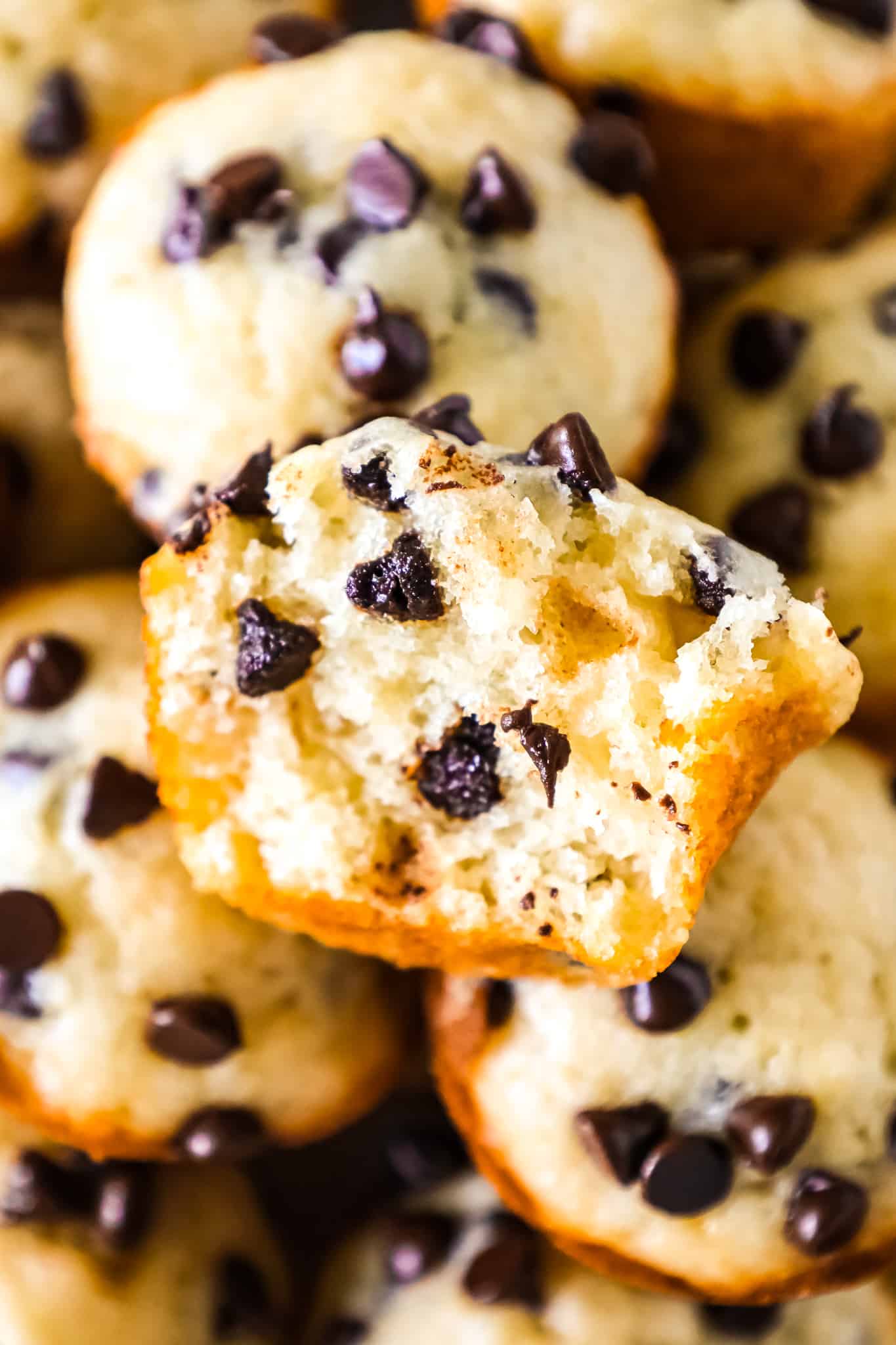 Mini Chocolate Chip Muffins are a tasty bite sized snack recipe that is sure to please both kids and adults.