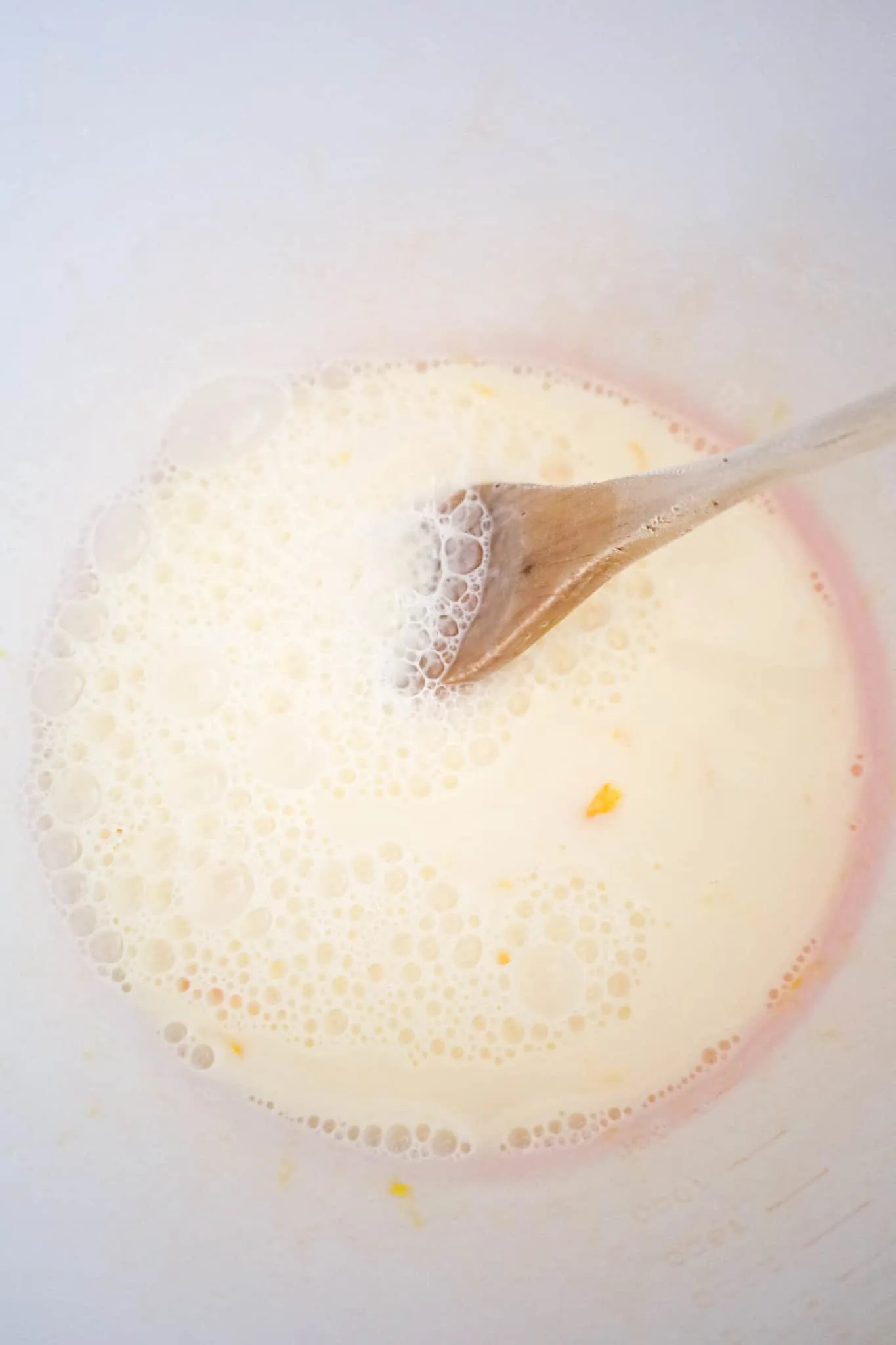 milk and egg mixture in a mixing bowl