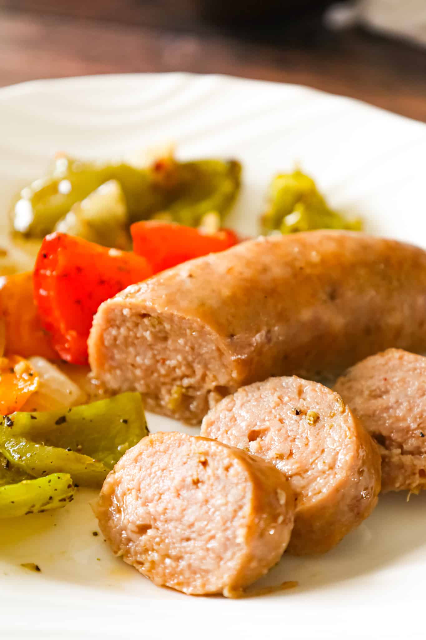 Oven Baked Italian Sausage is an easy sheet pan dinner with diced bell peppers and onions tossed in olive oil and Italian seasoning.