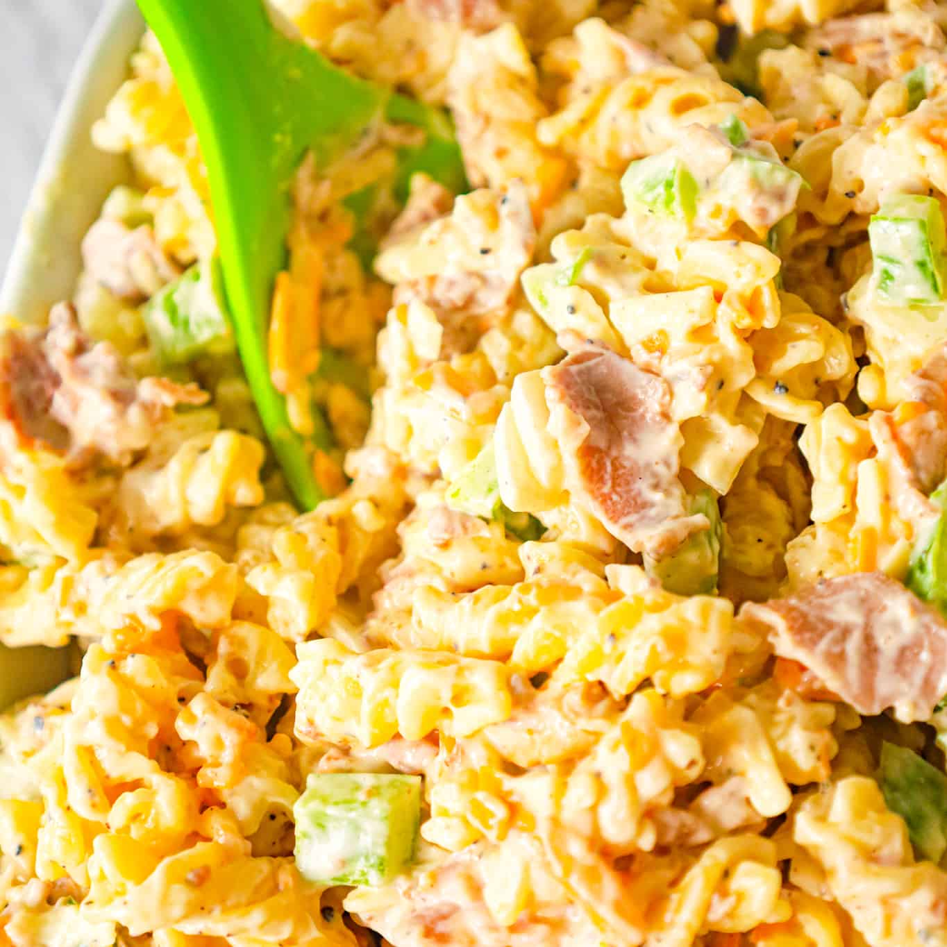 Philly Cheese Steak Pasta Salad is a tasty cold side dish recipe loaded with diced green peppers, onions, roast beef, mayo, shredded cheese and steak spice.