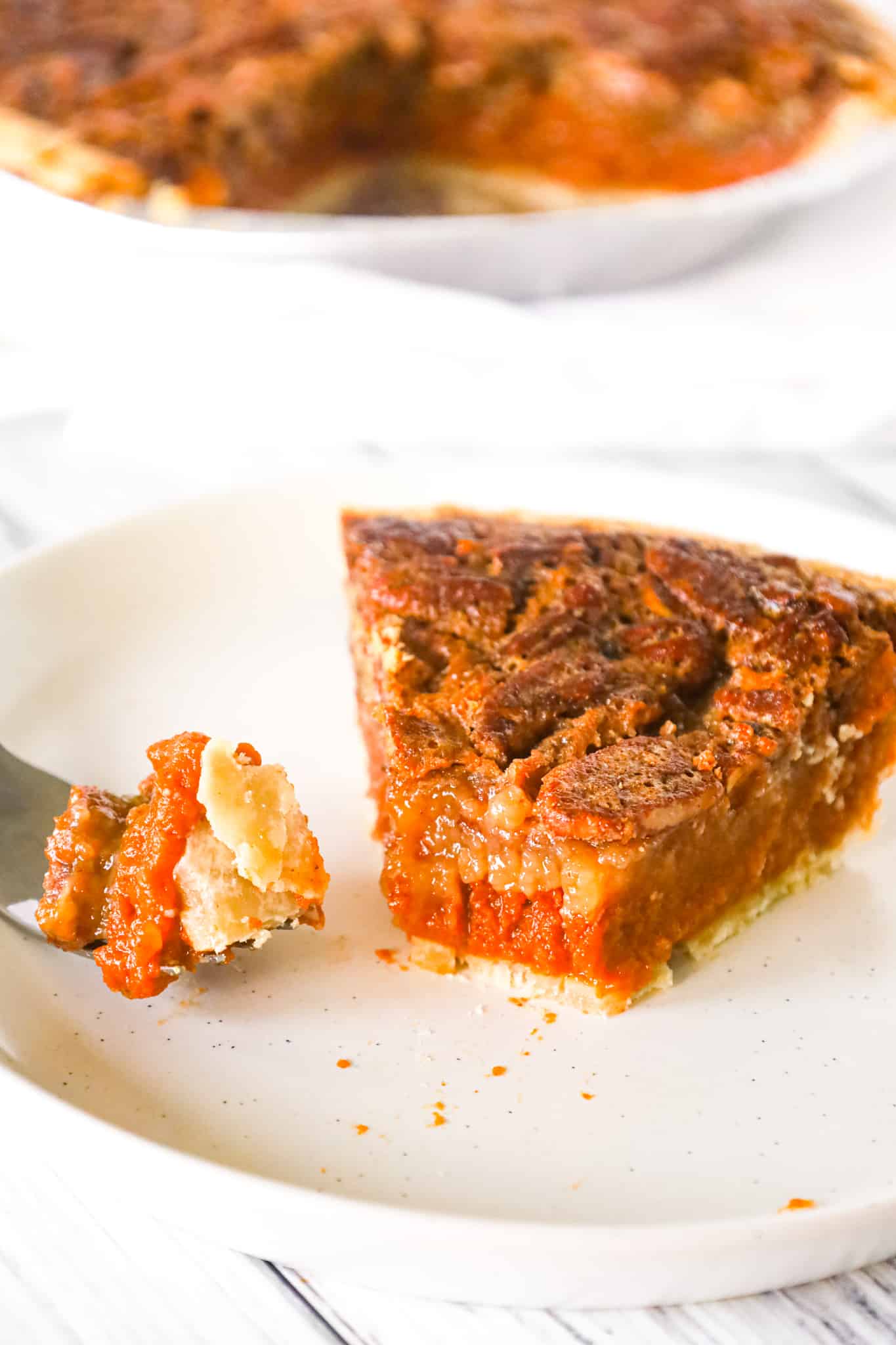 Pumpkin Pecan Pie is a delicious dessert recipe using a store bought pie crust with a layer of spiced pumpkin and topped with a gooey pecan mixture.