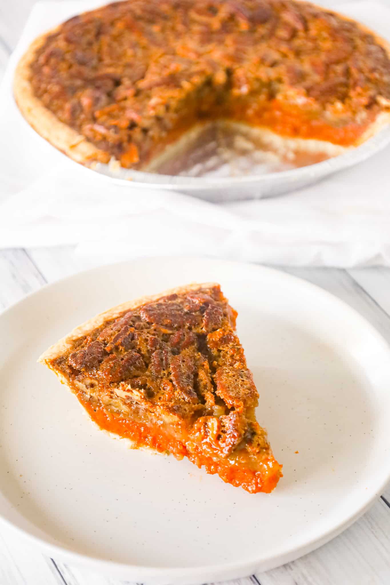 Pumpkin Pecan Pie is a delicious dessert recipe using a store bought pie crust with a layer of spiced pumpkin and topped with a gooey pecan mixture.