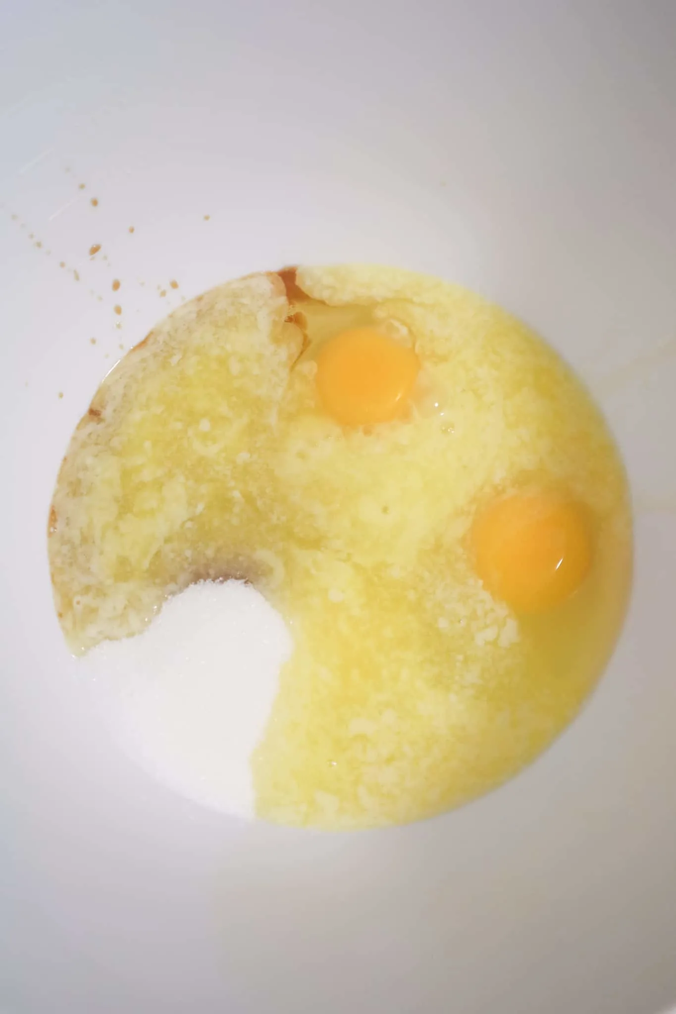 egg, sugar and melted butter in a mixing bowl
