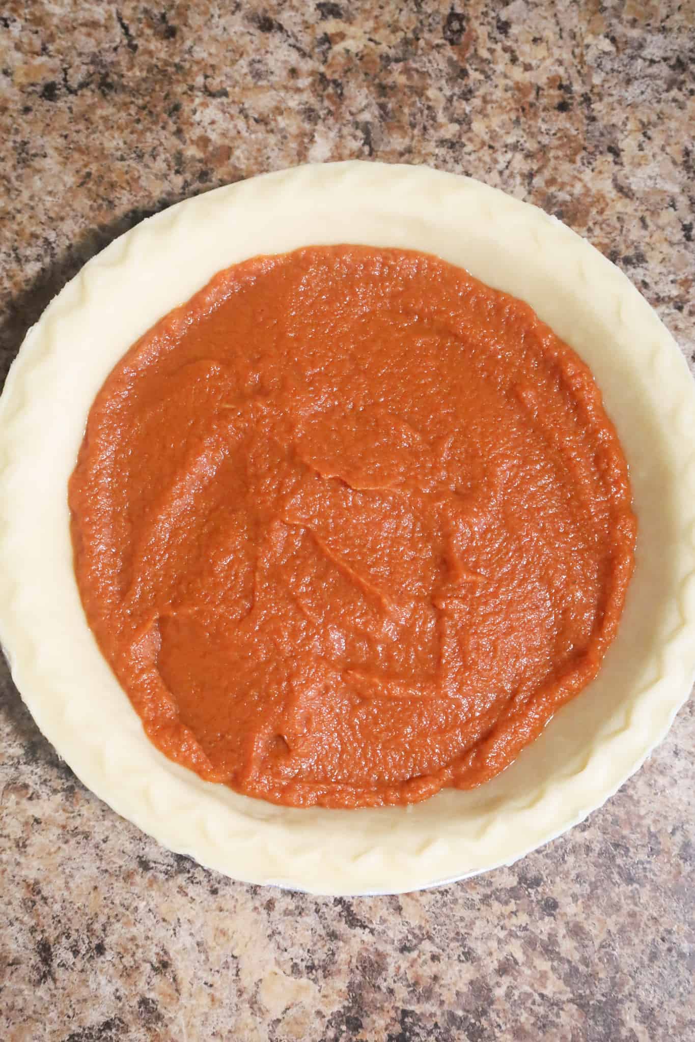 pumpkin mixture in an unbaked pie shell