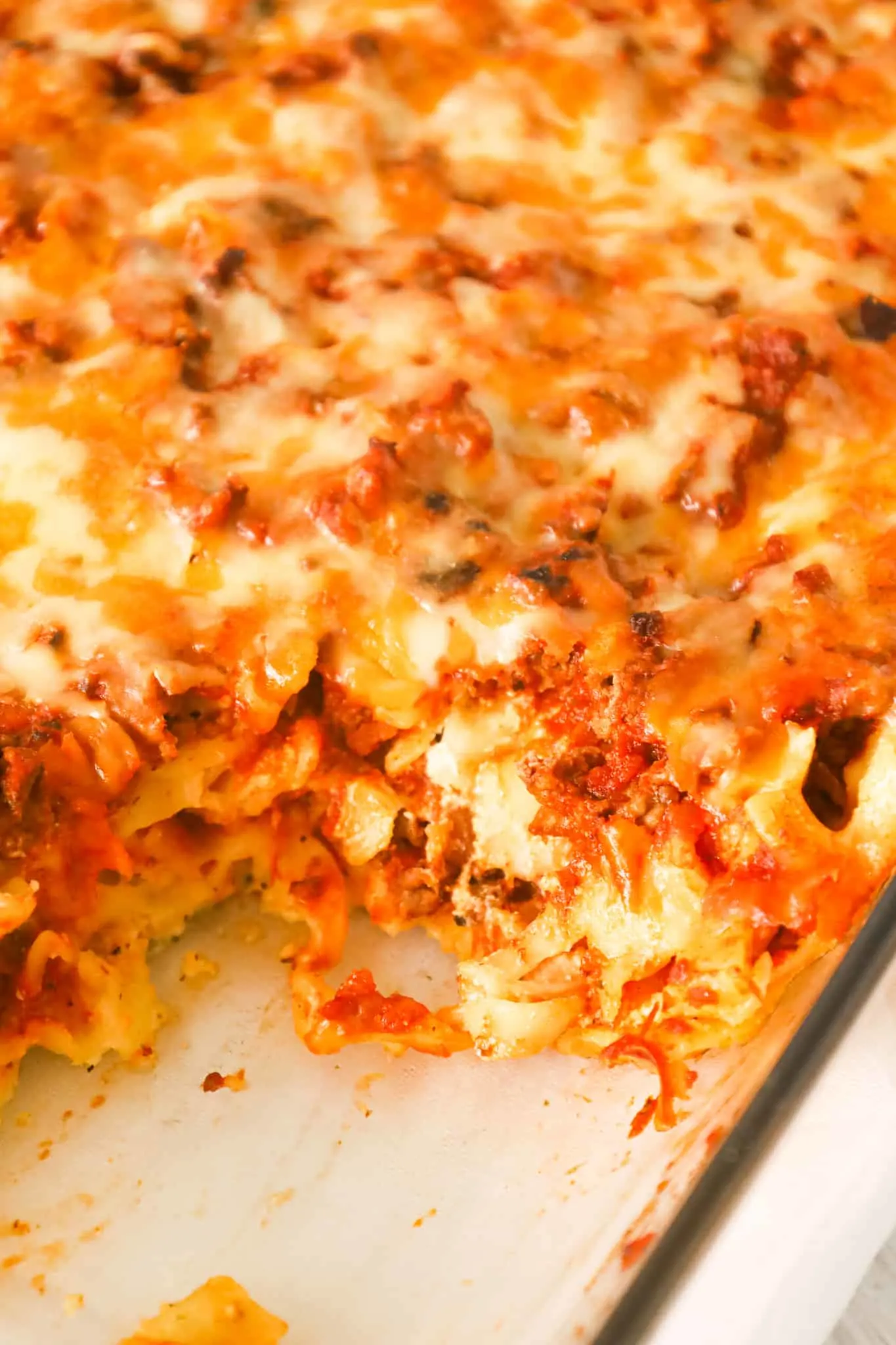 Sour Cream Noodle Bake is a hearty casserole loaded with ground beef, egg noodles, ricotta cheese, sour cream, marinara and shredded cheddar and mozzarella.